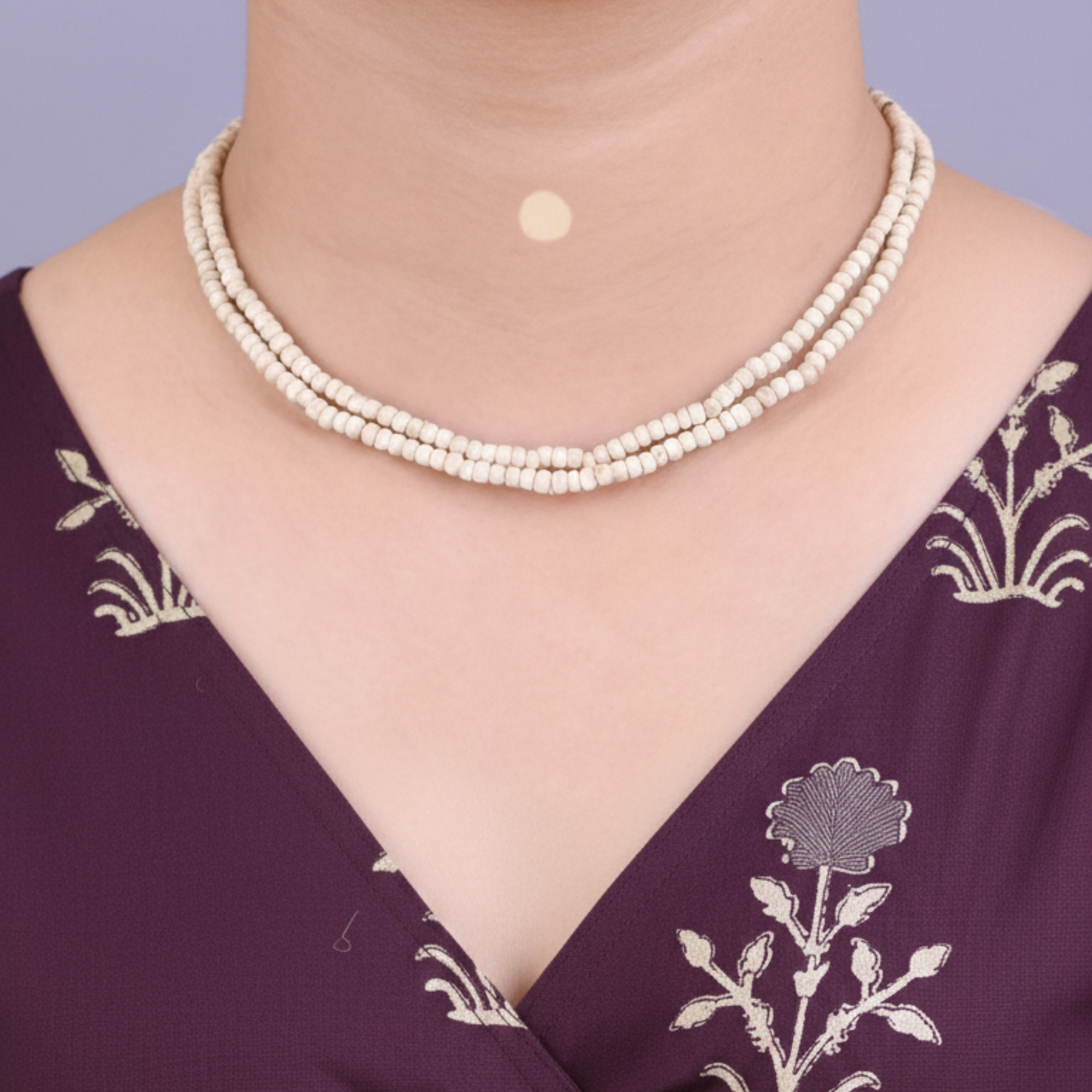 Woman wearing an original Tulsi kanthi mala wrapped twice around her neck in a 2-round style