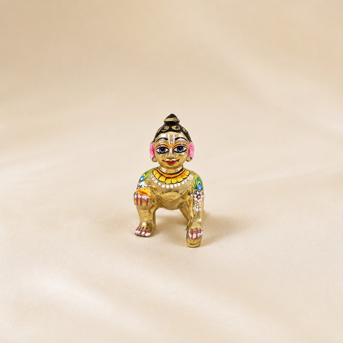 5 No. hand-painted golden Ashtadhatu Laddu Gopal idol measuring 10.5 cm high and 6 cm wide.