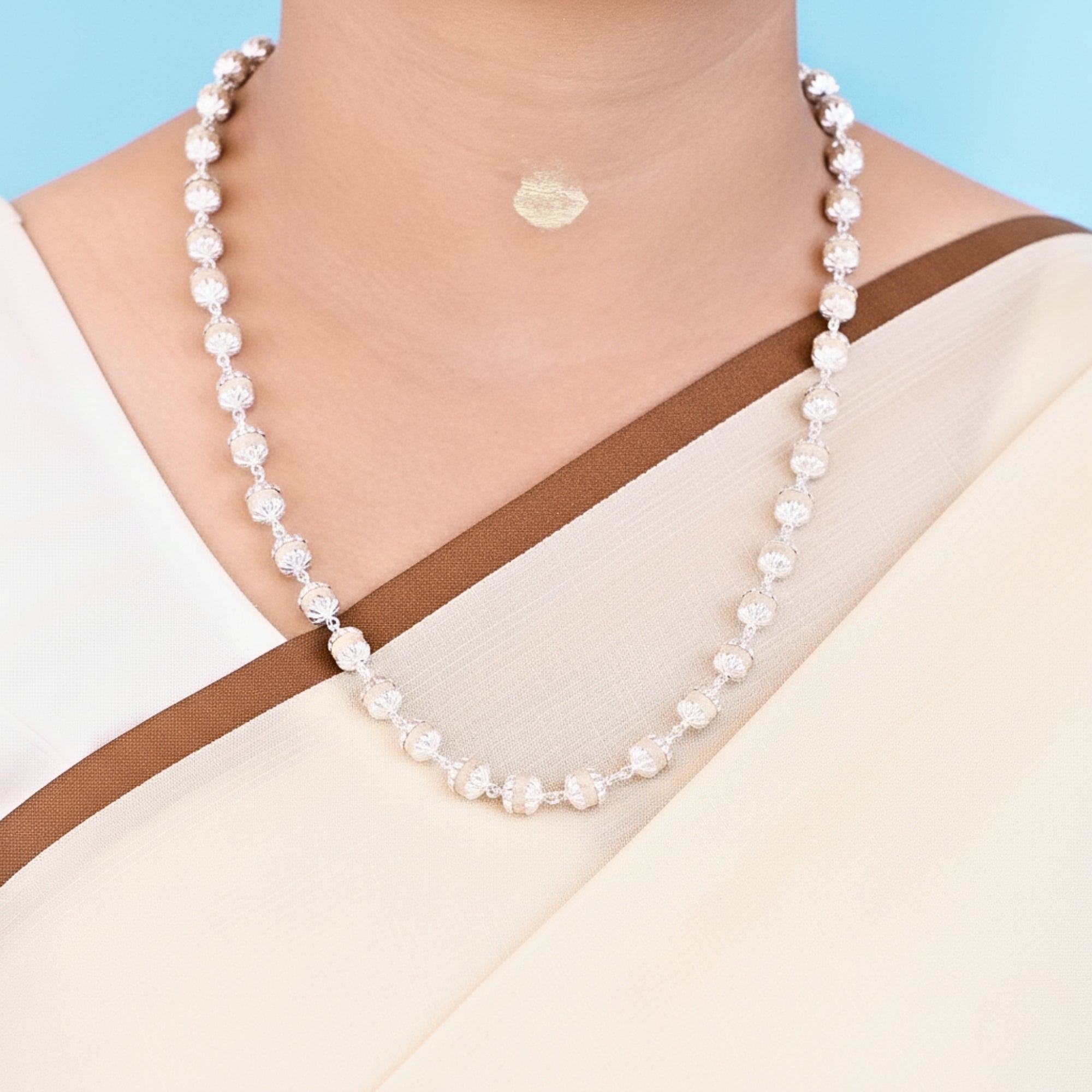Woman wearing a premium 925 pure silver capped original Tulsi Kanthi Mala