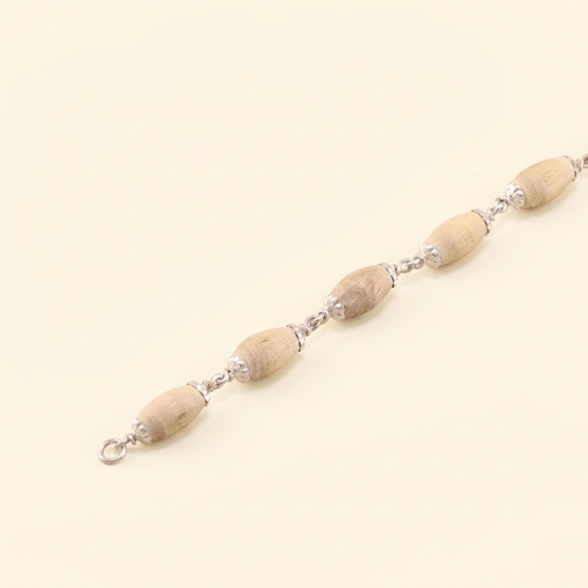 925 silver bracelet featuring smooth oval Tulsi wood beads
