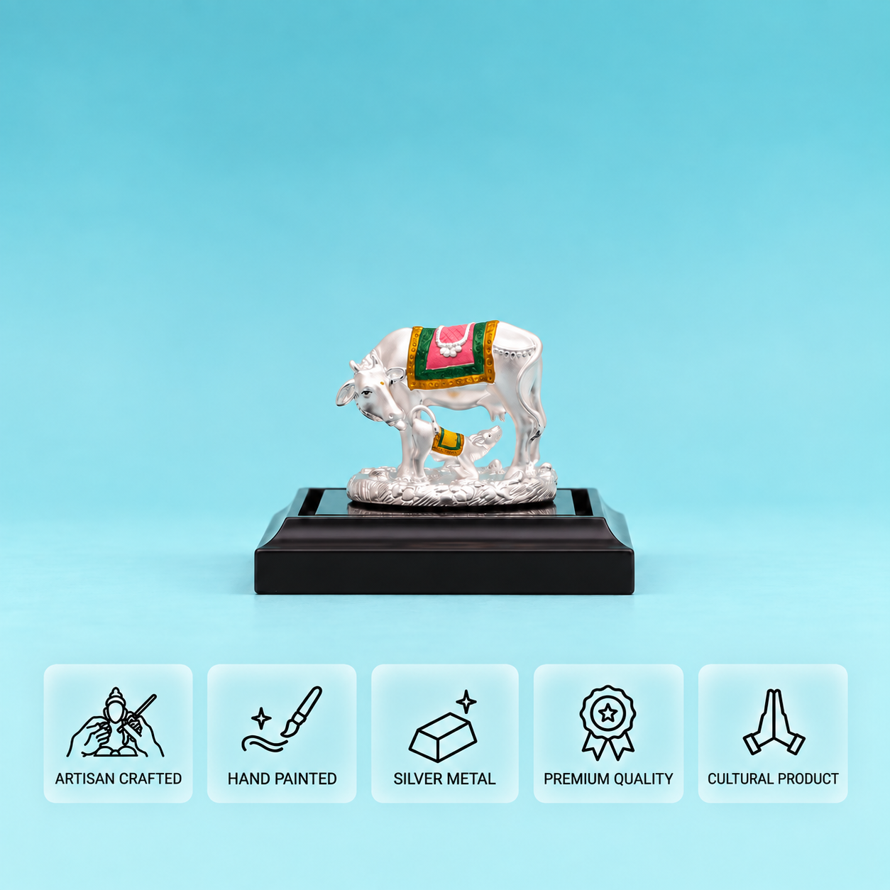 925 Silver cow and calf idol with a pink, green and gold saddle on a black pedestal, above five feature cards.