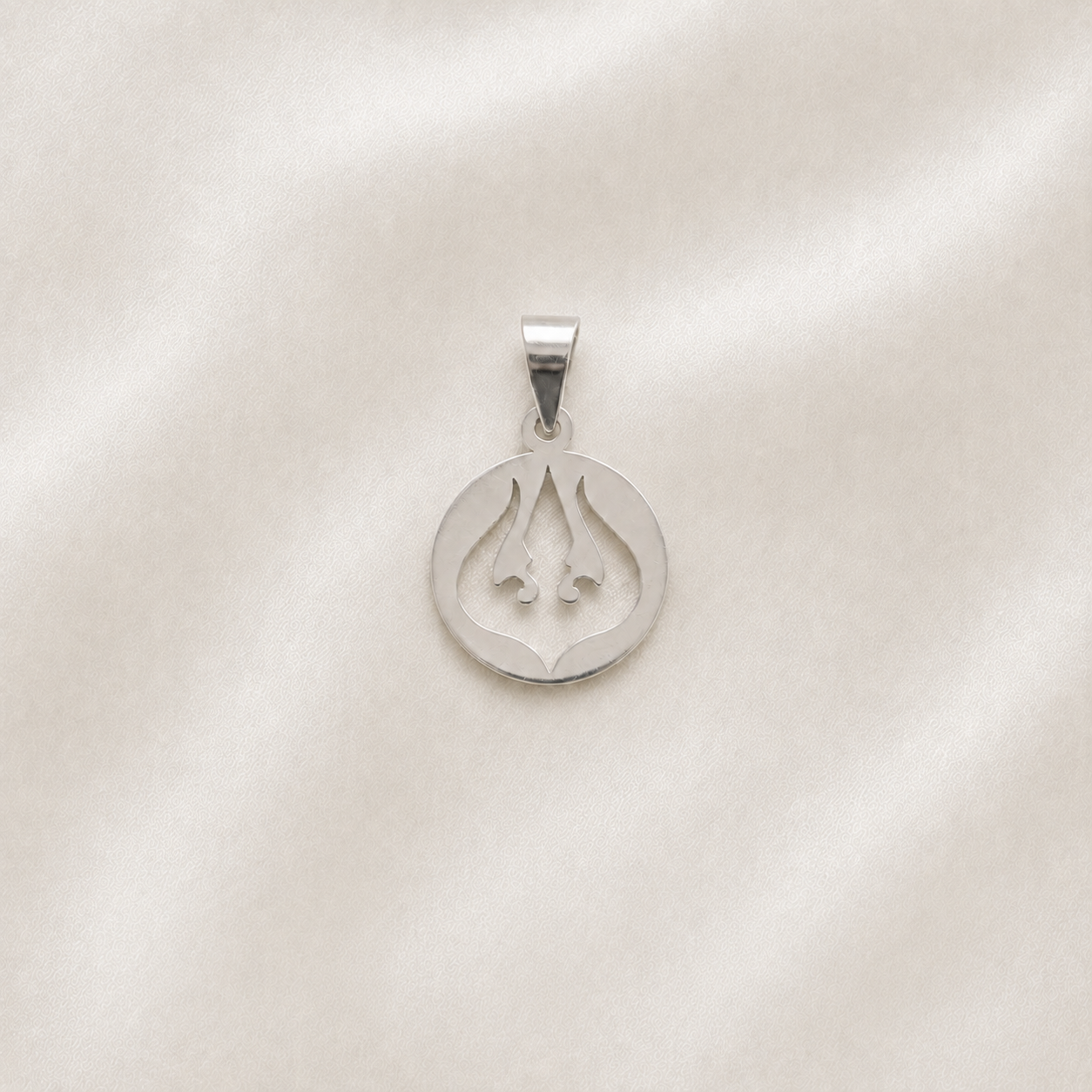 925 silver trident pendant with a symmetrical sacred design displayed on ivory satin