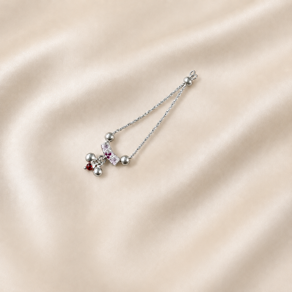 Pure silver necklace for Kanha Ji with pink stones and pearl drops on cream silk fabric