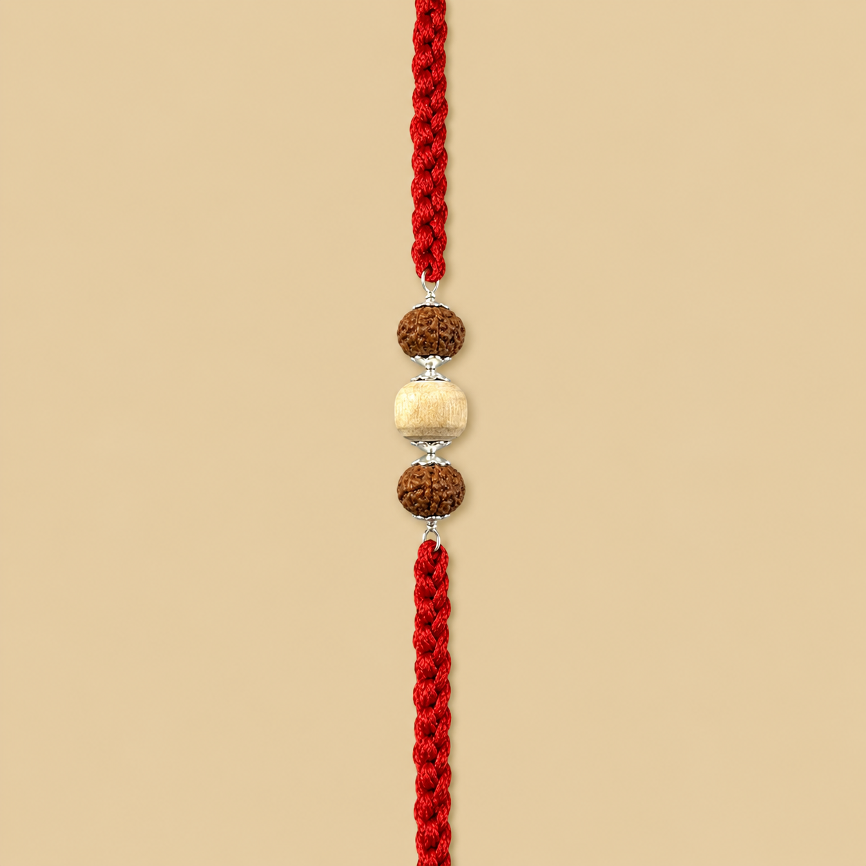 925 pure silver capped central Rudraksha and smooth oval Tulsi beads rakhi on red thread flat lay view