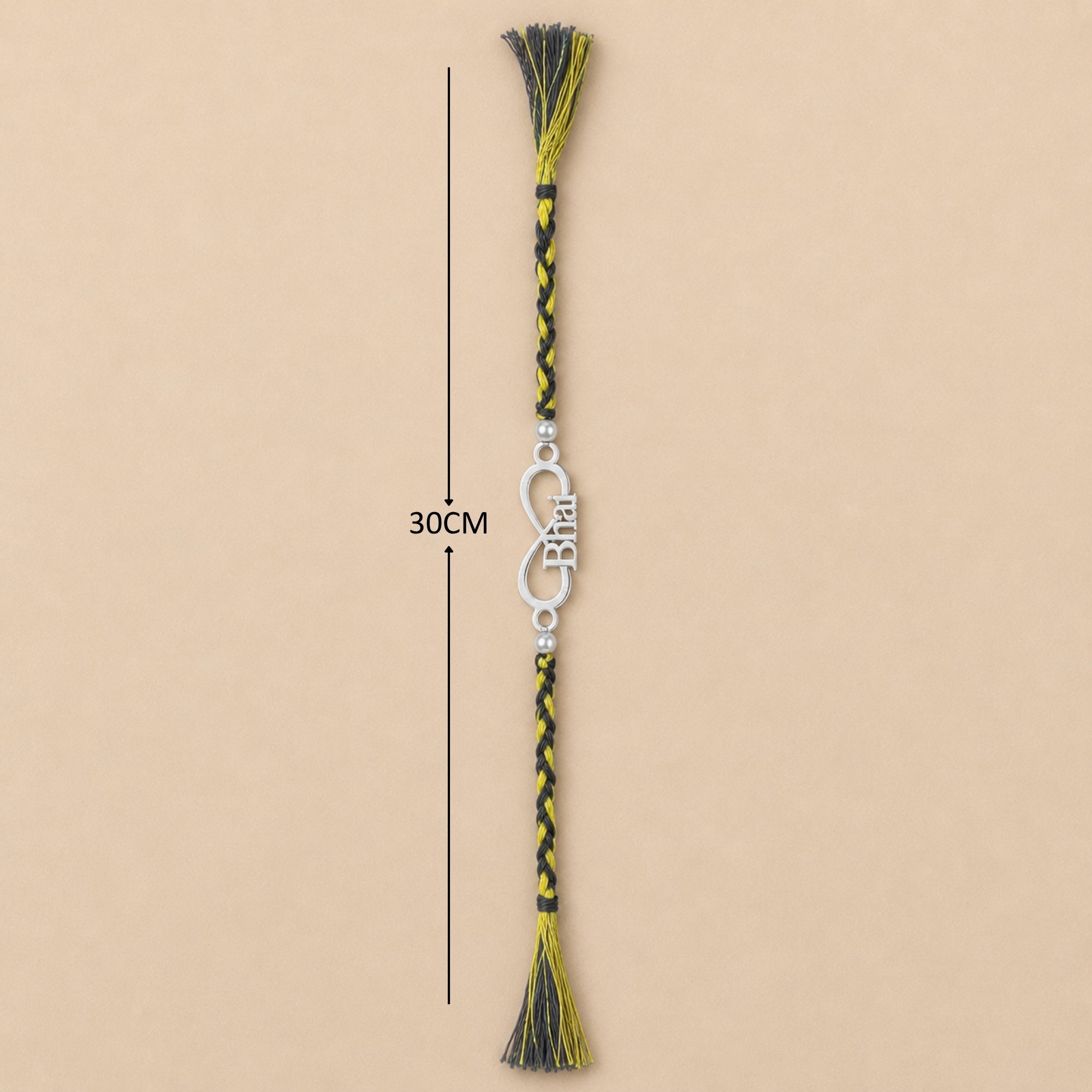 Full length view showing thread layout and tassels of 925 silver infinity Bhai word rakhi