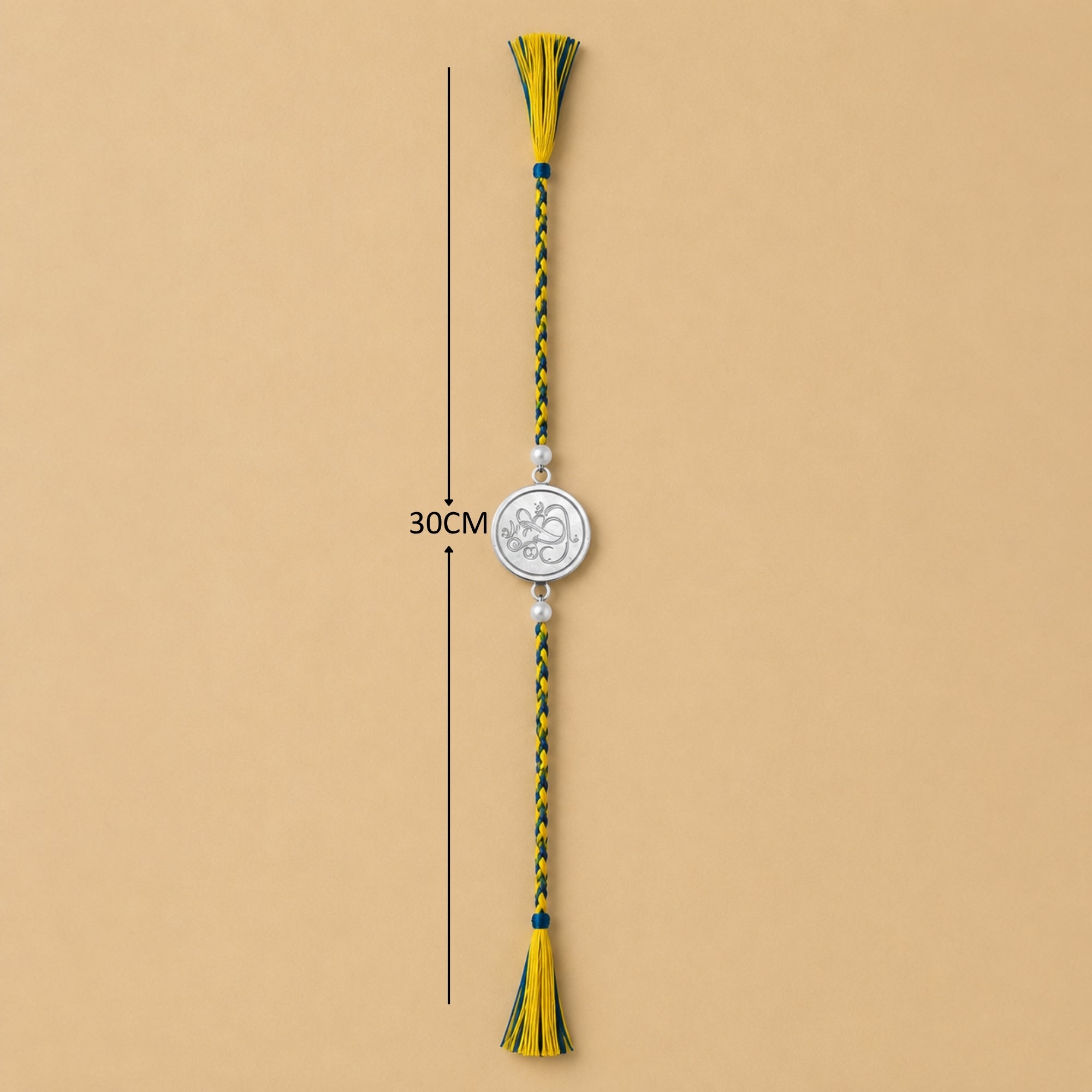 Full length view showing thread layout and tassels of 925 silver Lord Ganesha coin rakhi