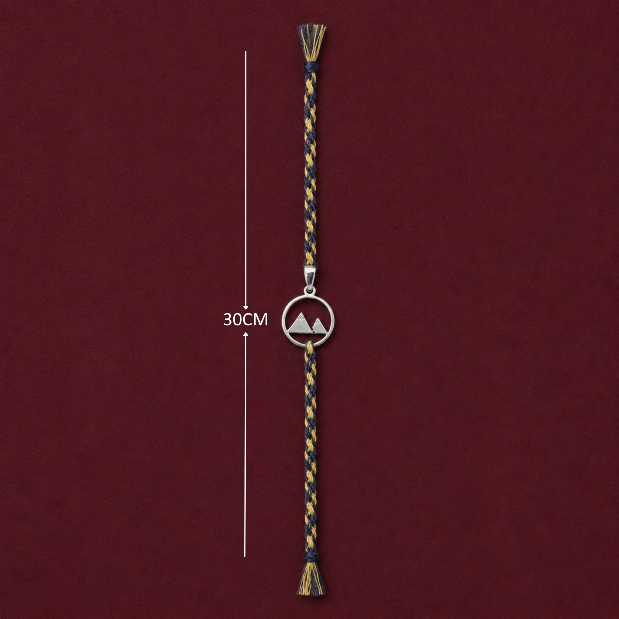 Full length view showing thread layout and tassels of 925 silver mountain peak rakhi