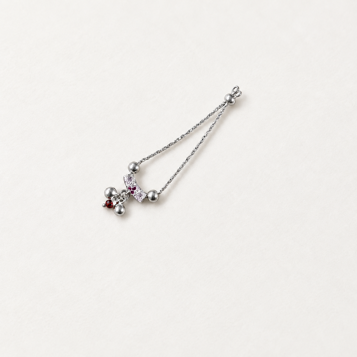Pure silver necklace for Kanha Ji with pink stones and pearl drops on off-white fabric