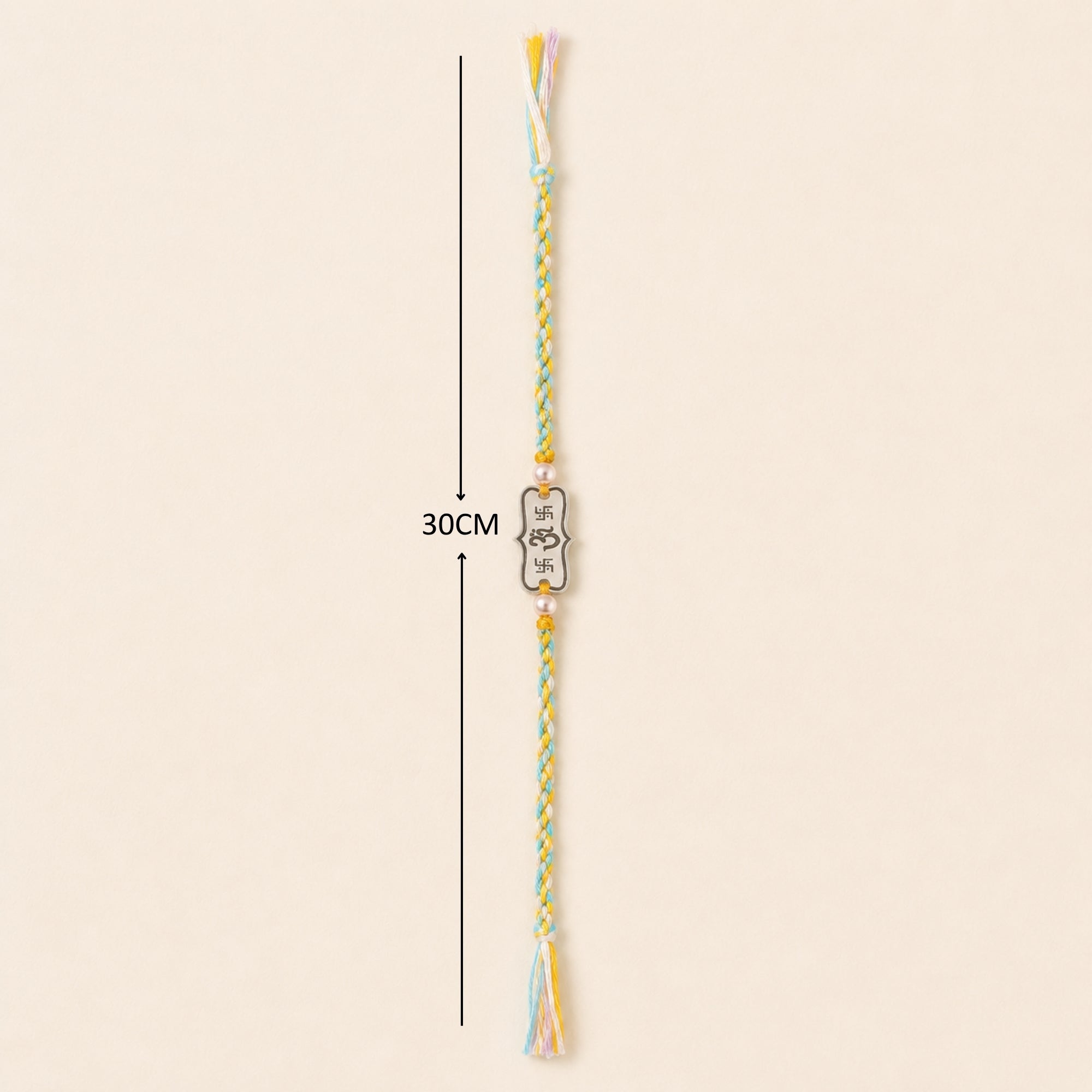 Full length layout showing thread length and dimensions of 925 pure silver Om inscribed pearl rakhi