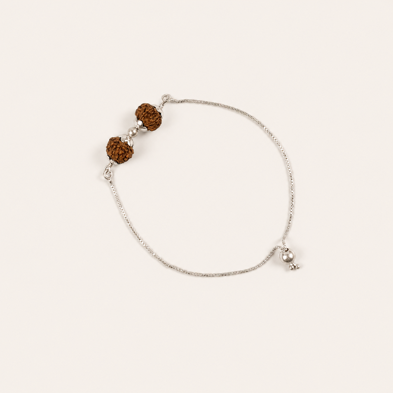 925 sterling silver Rudraksha bead chain bracelet with pearl accents and charm flat lay view