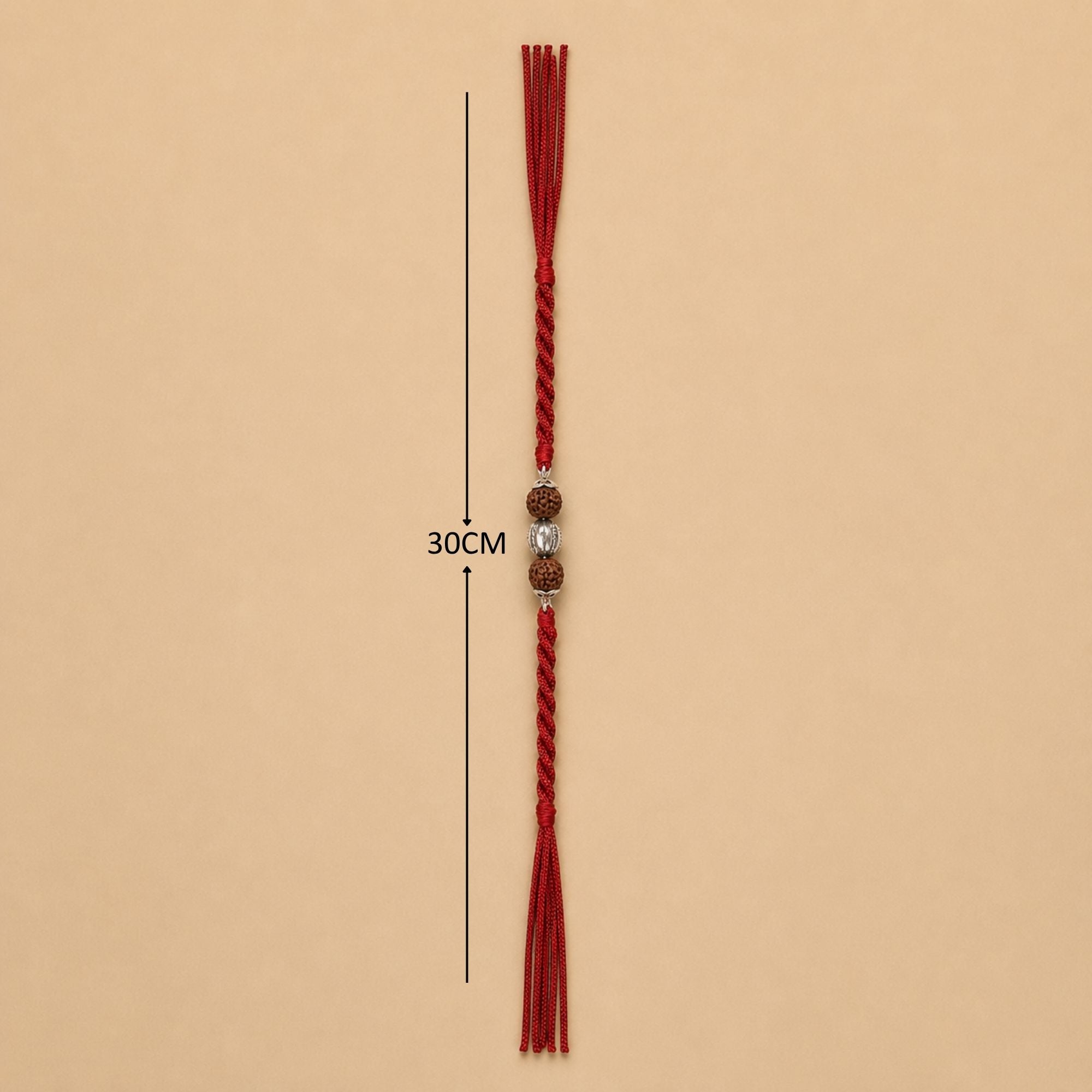 Full length red thread layout showing dimensions of silver Rudraksha rakhi