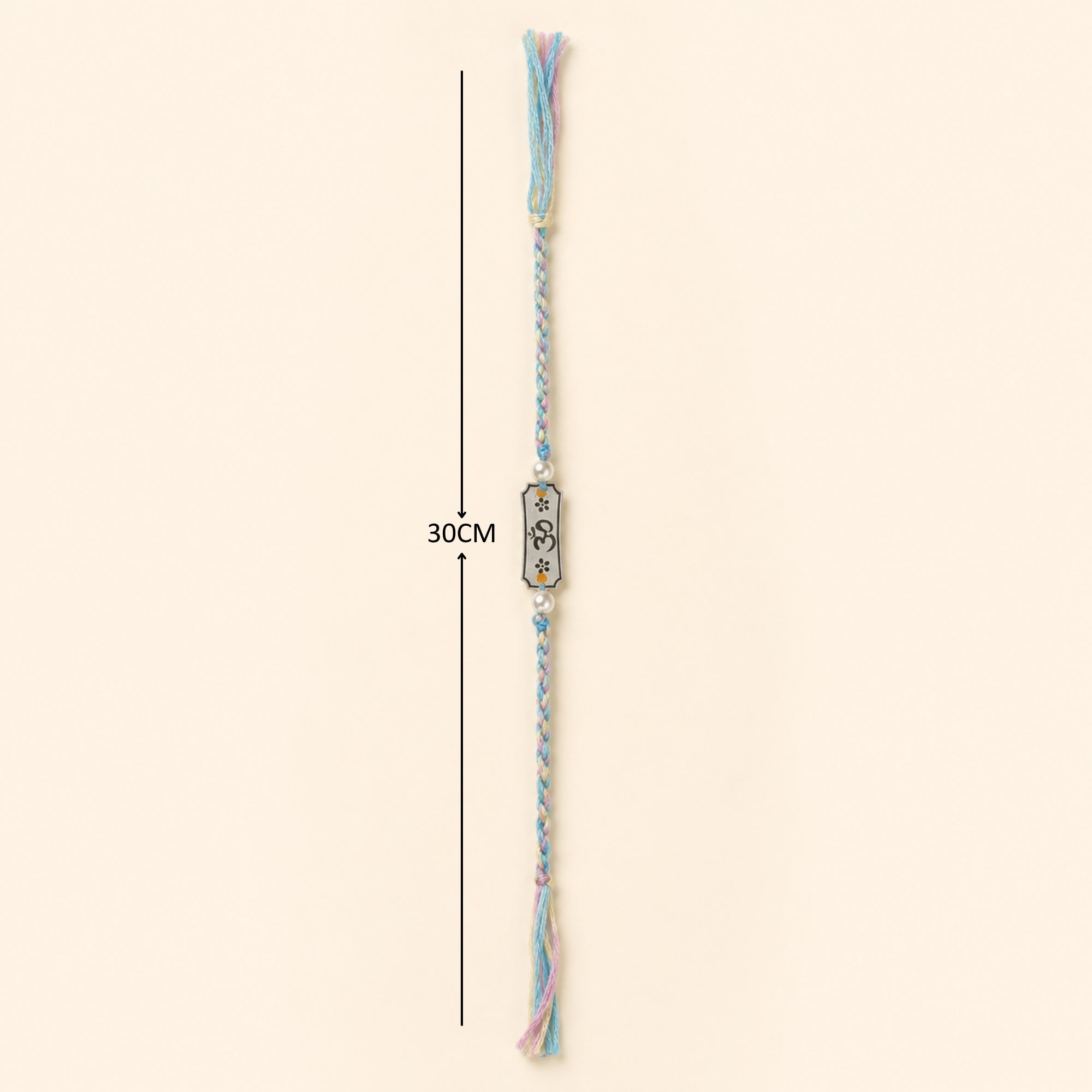 Full length layout showing thread length and dimensions of 925 silver Subh Om Labh inscribed pearl rakhi on blue cord