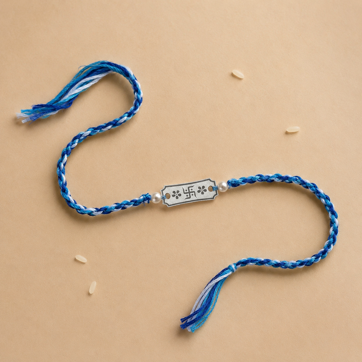 925 pure silver Swastik floral engraved charm rakhi with pearl beads on twisted blue white cord