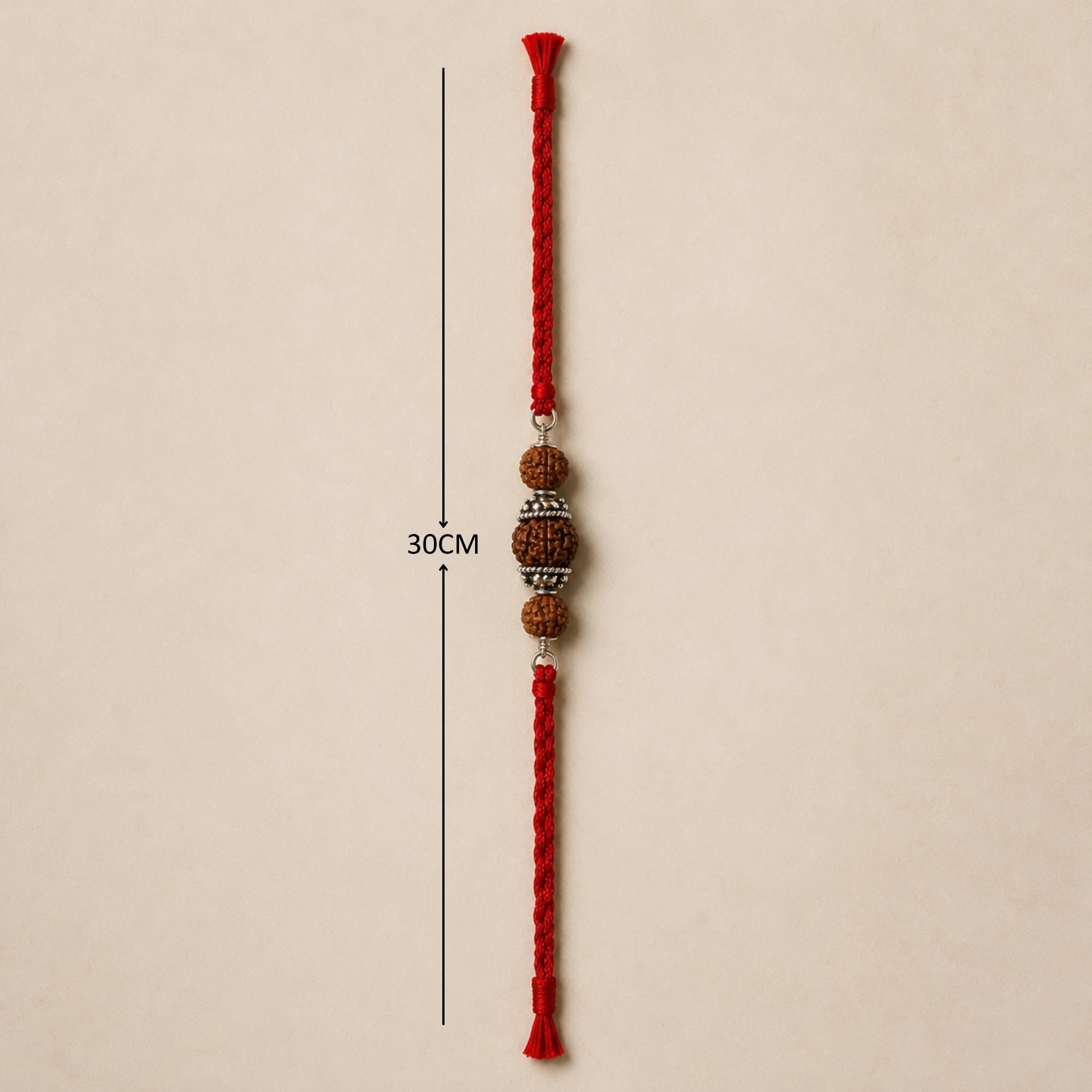 Full length view showing red thread layout and dimensions of 925 silver three Rudraksha rakhi