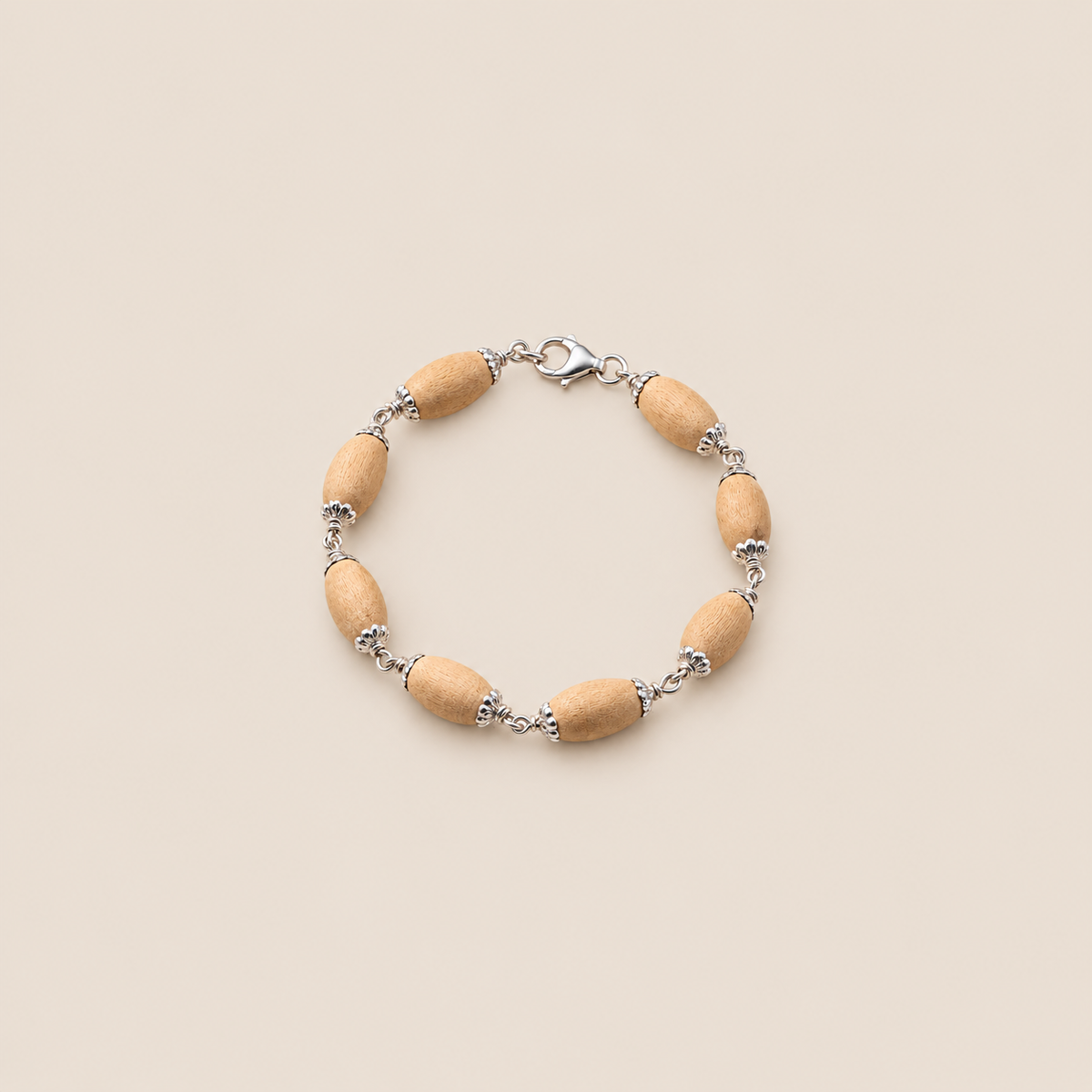 Tulsi wood bracelet with oval beads, 925-silver floral bead caps and a lobster clasp 