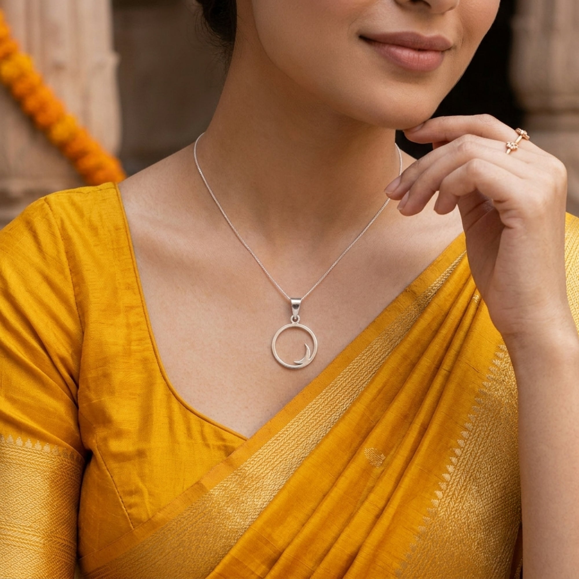 Model wearing 925 sterling silver crescent half moon pendant for men and women with yellow saree