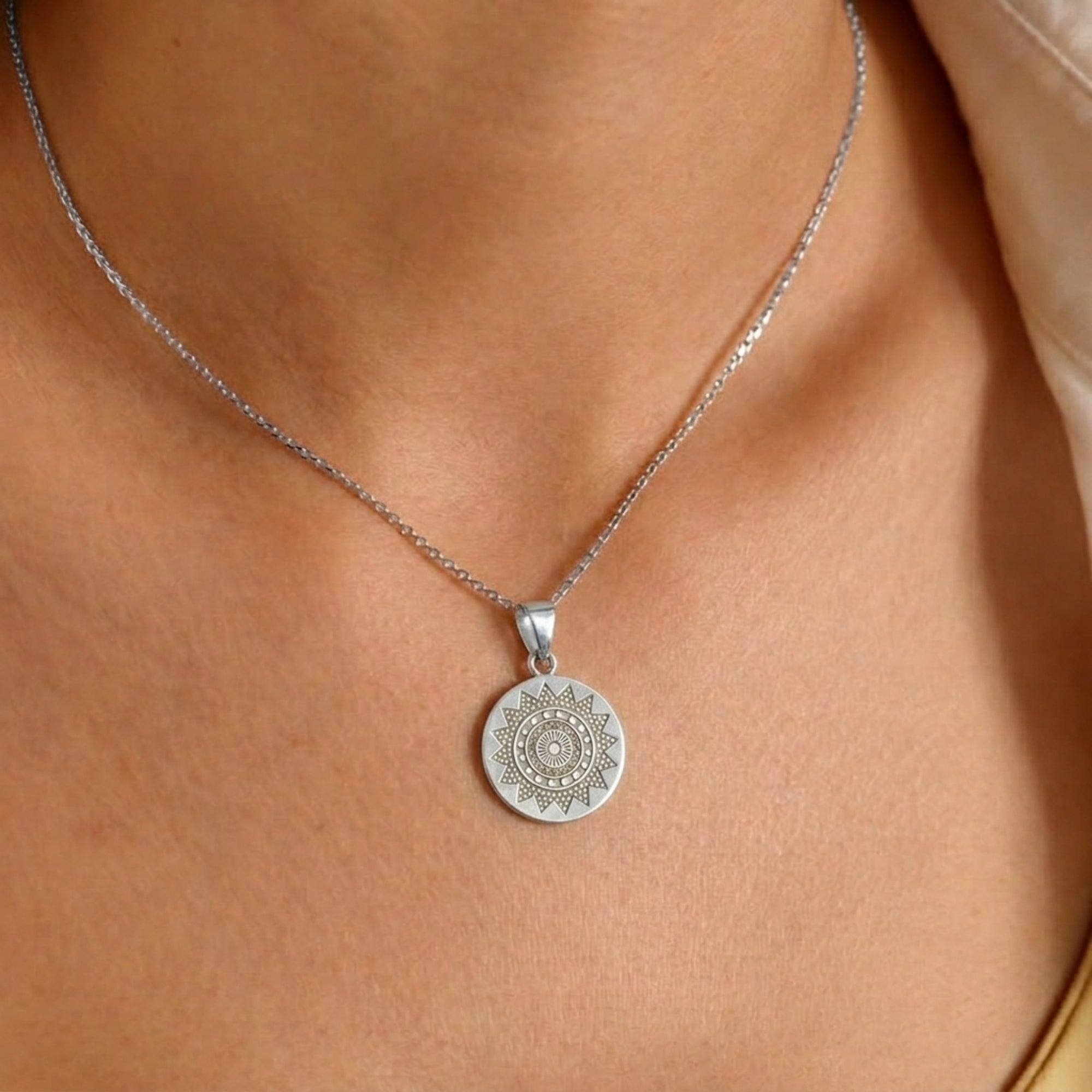 Model wearing 925 sterling silver divine Chakra disc pendant for men and women