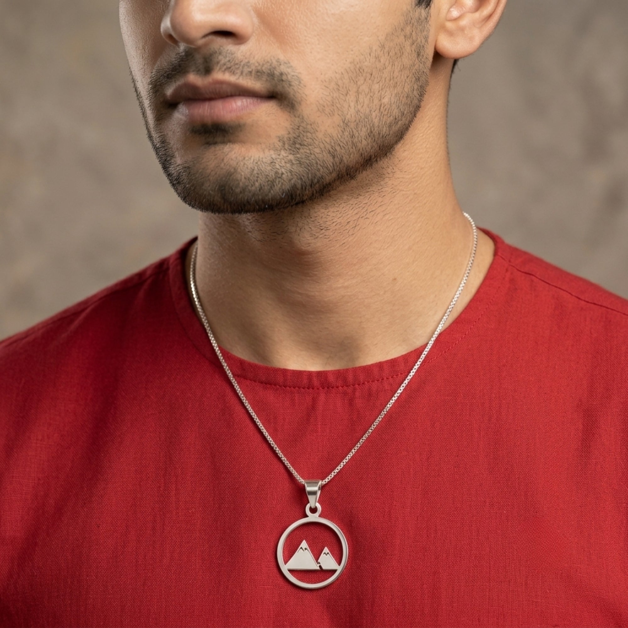 Model wearing 925 sterling silver mountain range pendant for men and women with red shirt