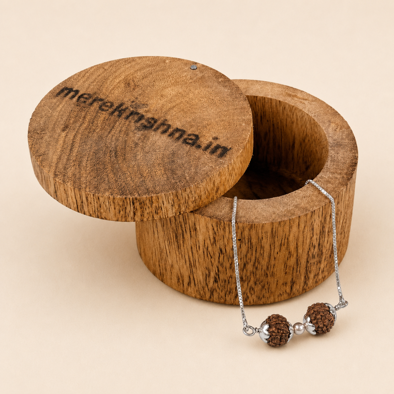 925 sterling silver natural Rudraksha bead chain bracelet displayed on round wooden box