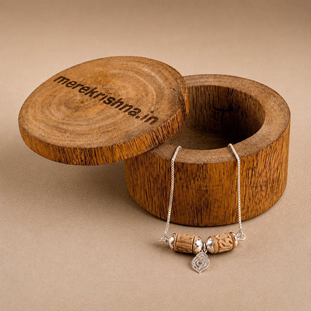 925 sterling silver natural Tulsi bead chain bracelet displayed on round wooden box