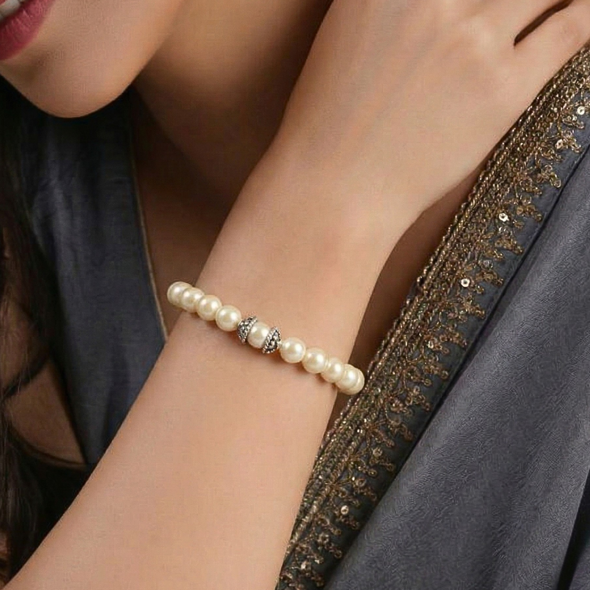 Model wearing 925 sterling silver natural white pearl bracelet for women with grey saree