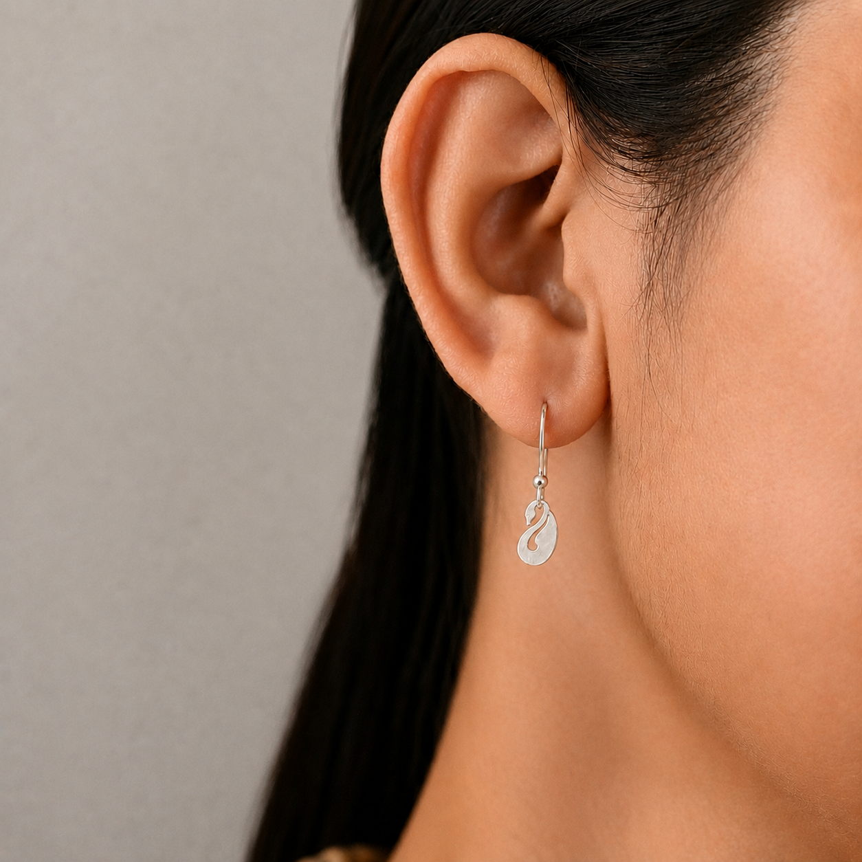 Model wearing 925 sterling silver peacock drop wire hook earrings