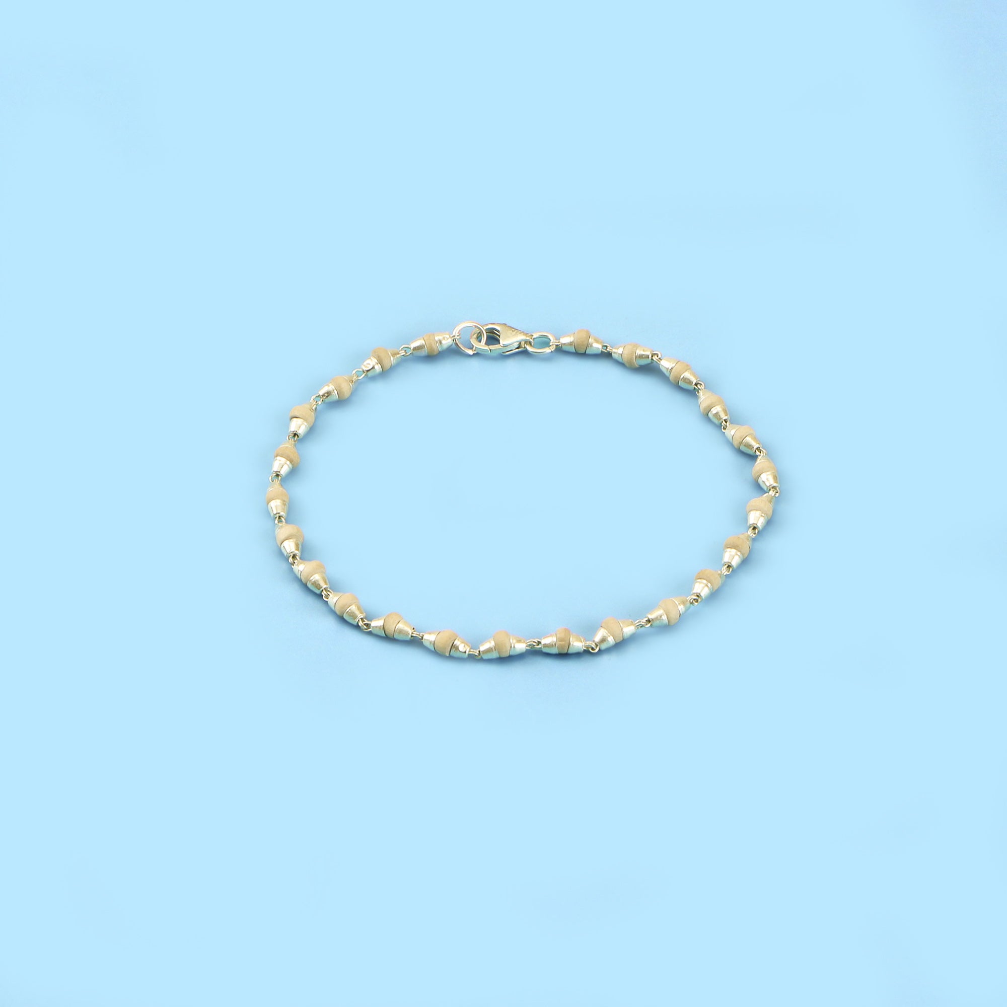 Handmade Silver Tulsi Bracelet featuring 4mm beads with sterling silver capping, ideal for spiritual occasions.