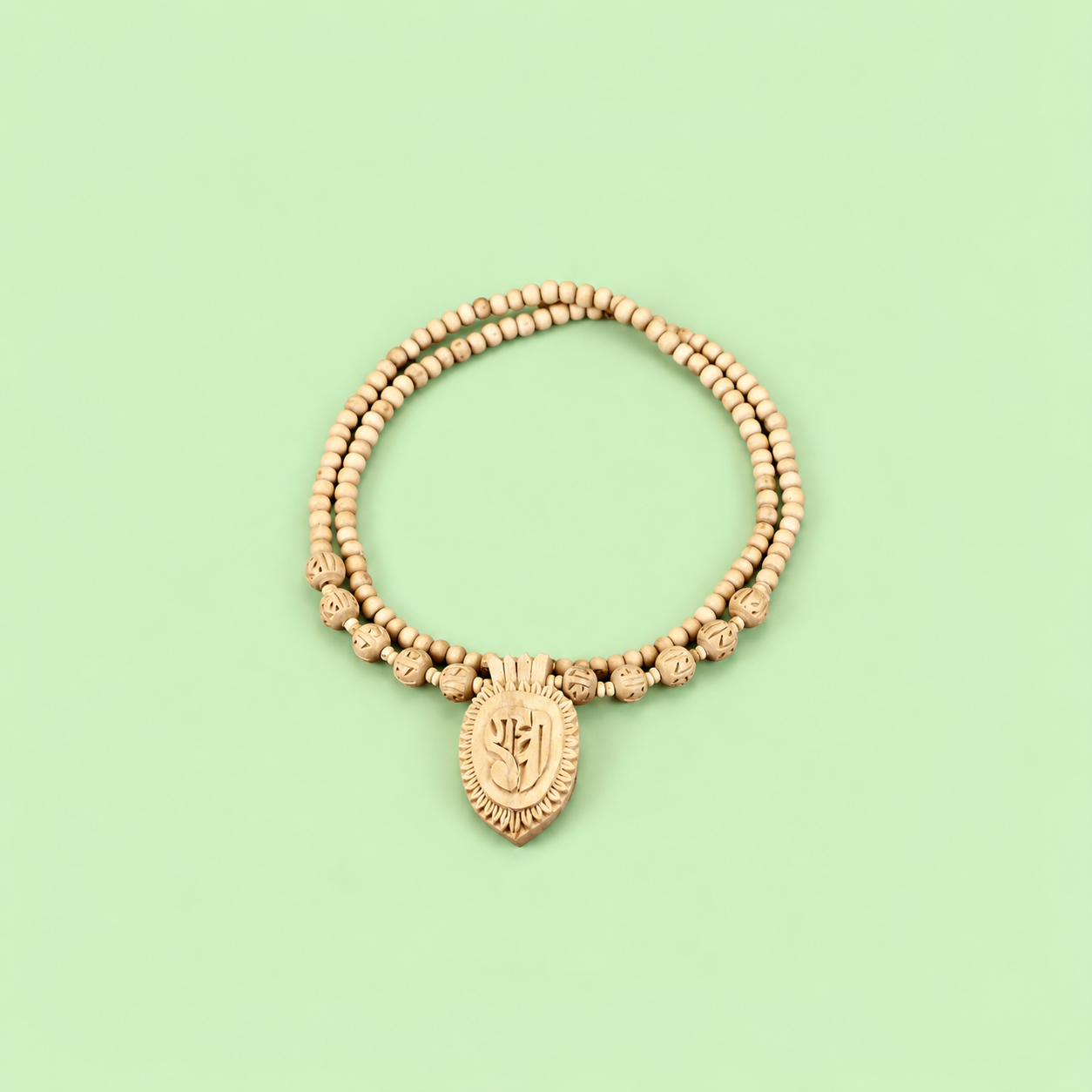 Handcrafted double-strand wooden bead necklace with a carved leaf-shaped pendant