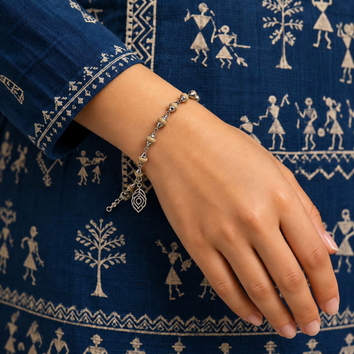 Handcrafted silver bracelet with natural beads and a delicate leaf-shaped charm