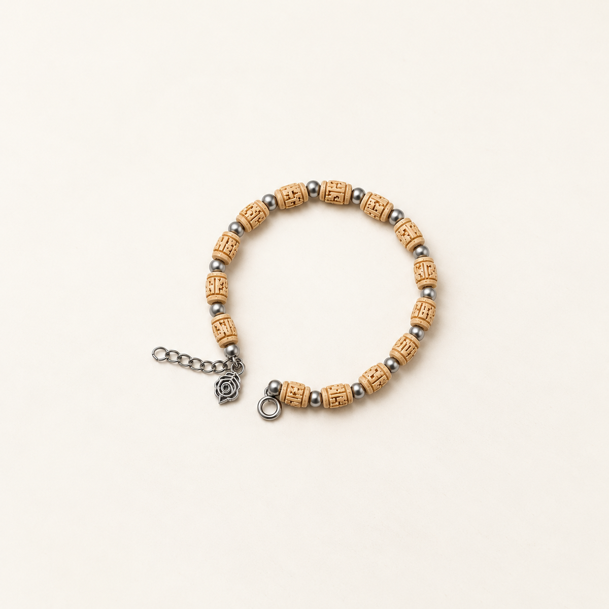 Handcrafted wooden bead bracelet with carved natural beads, silver spacers, extender chain