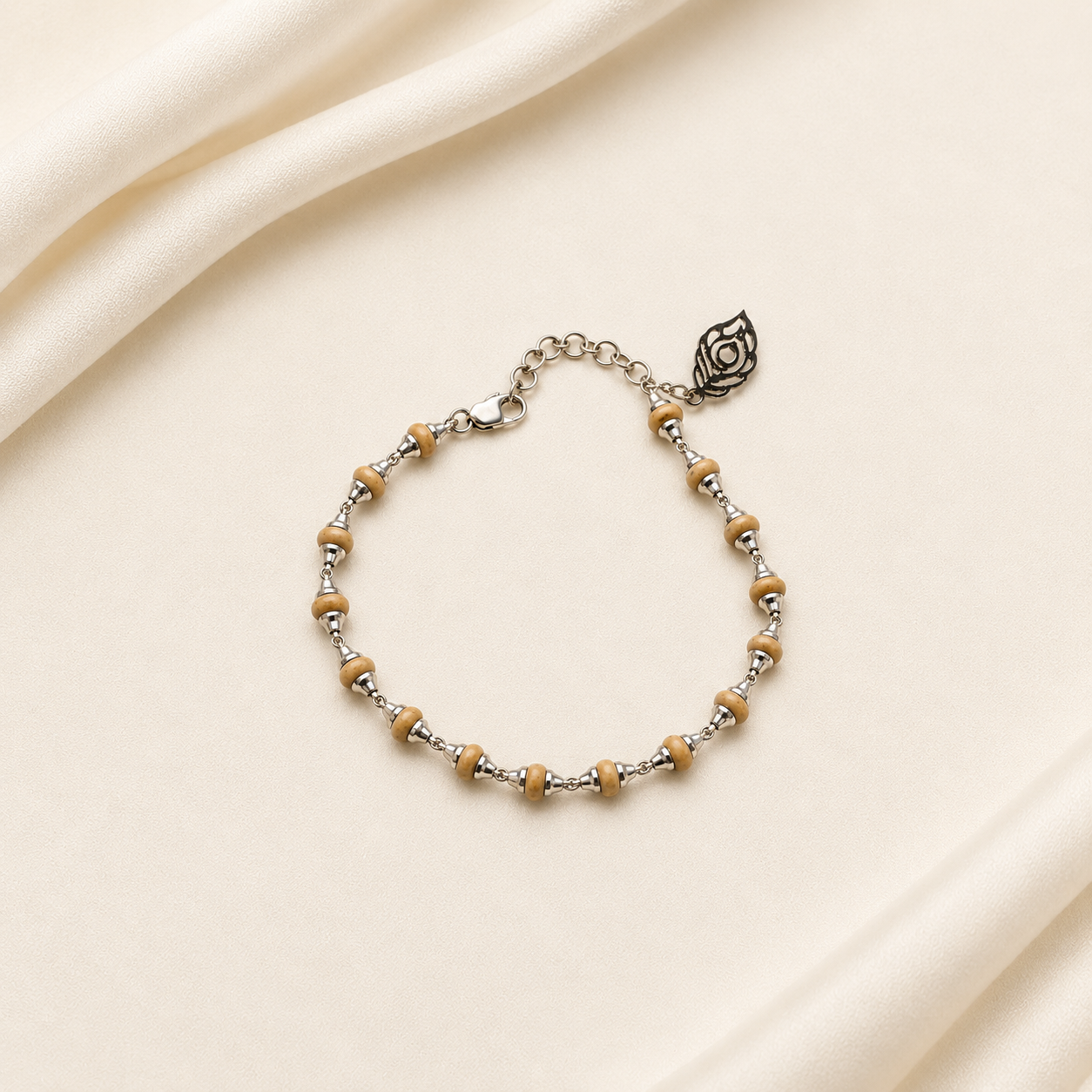 Handcrafted wooden bead bracelet with silver spacers, adjustable chain and leaf-shaped charm
