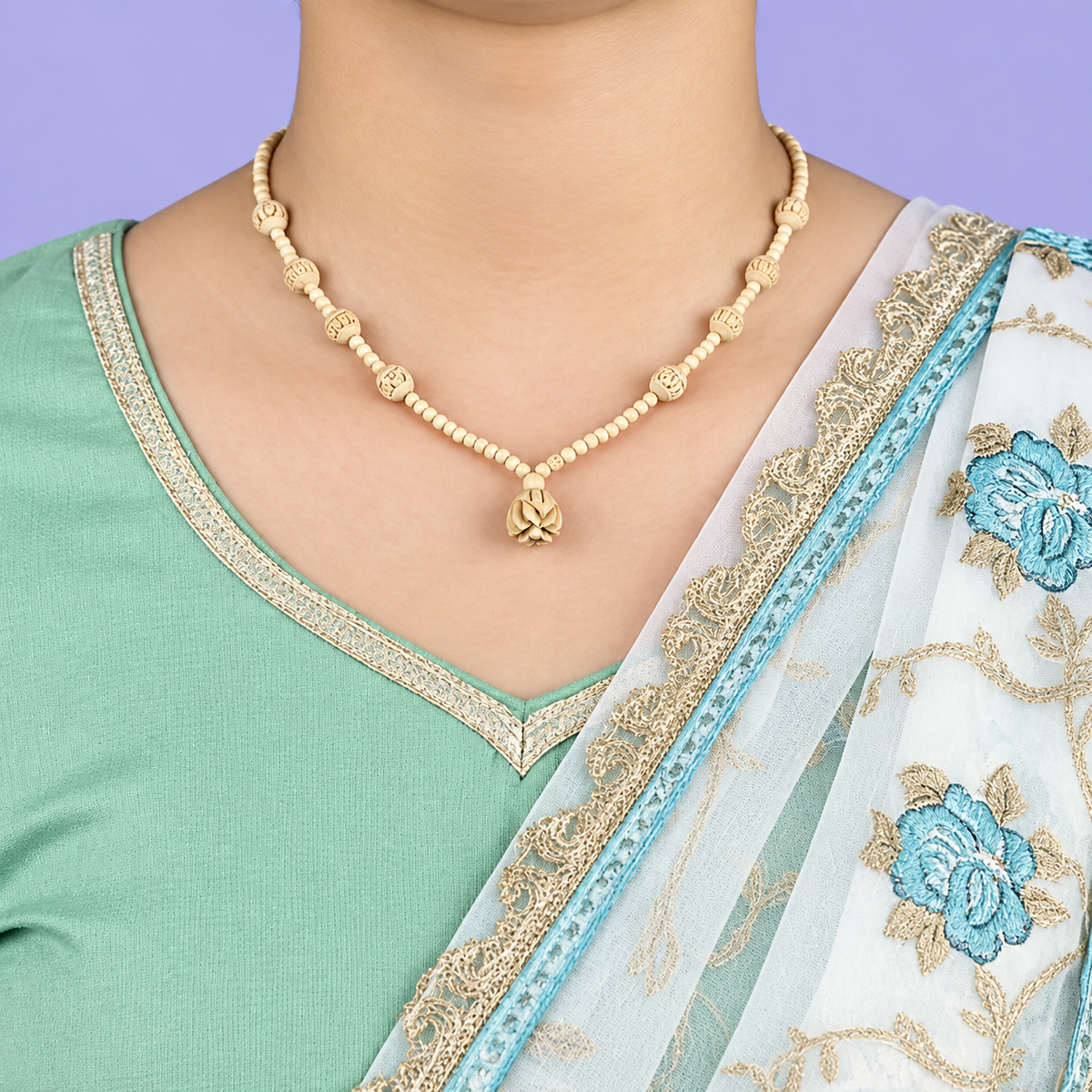 Handcrafted wooden bead necklace with carved lotus pendant