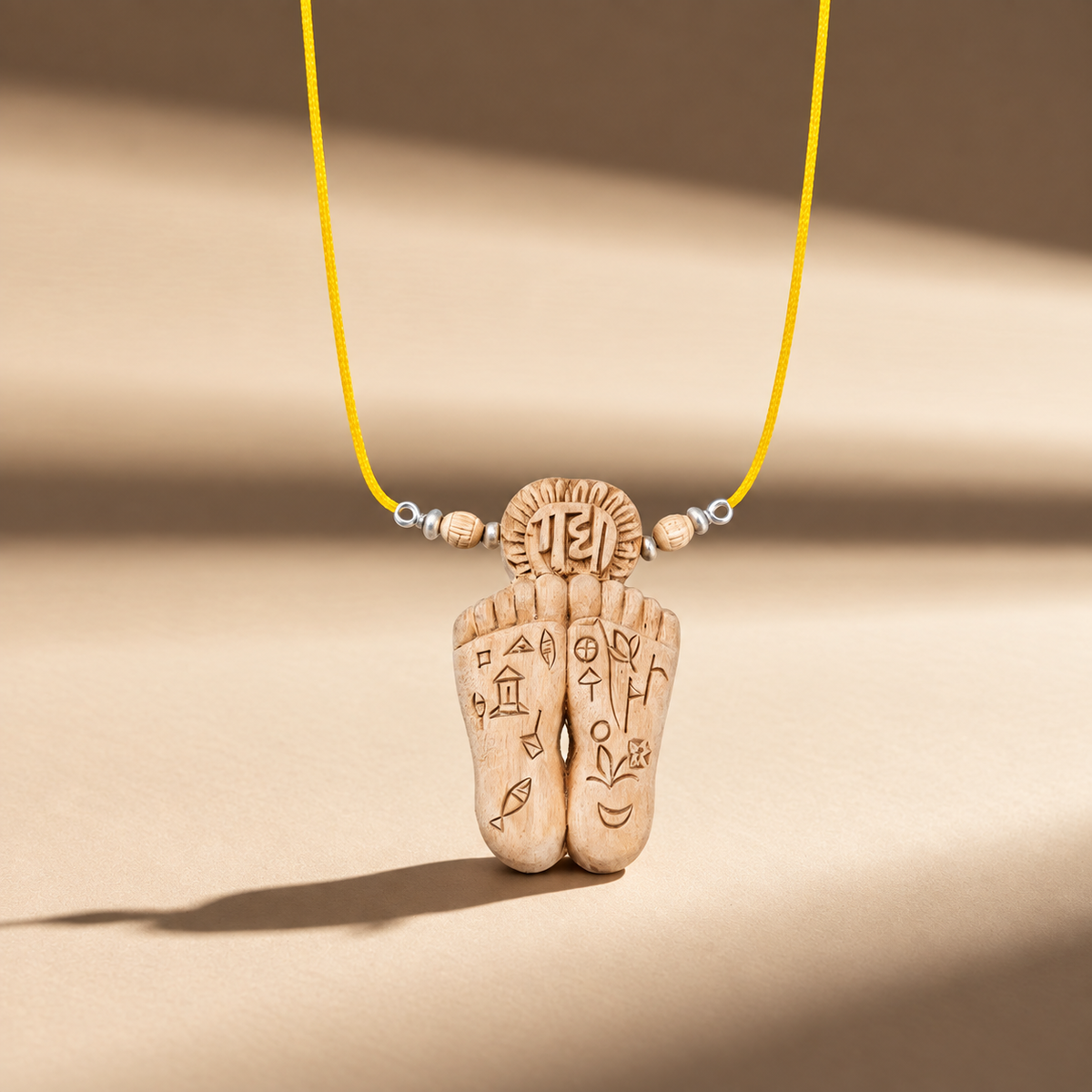 Handcrafted wooden charan pendant necklace with carved detailing