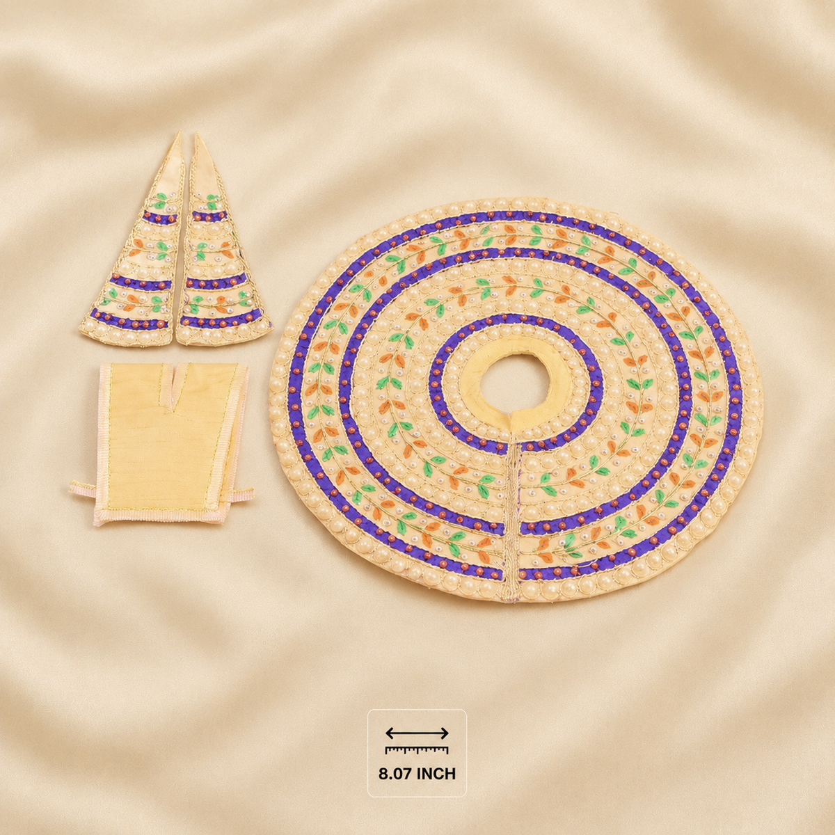 A set of three hand-embroidered beige fabric pieces, including a large circular piece with concentric floral patterns in purple, orange, and green, and two smaller pointed triangular pieces, displayed on a beige satin fabric background with an 8.07 inch size marker.