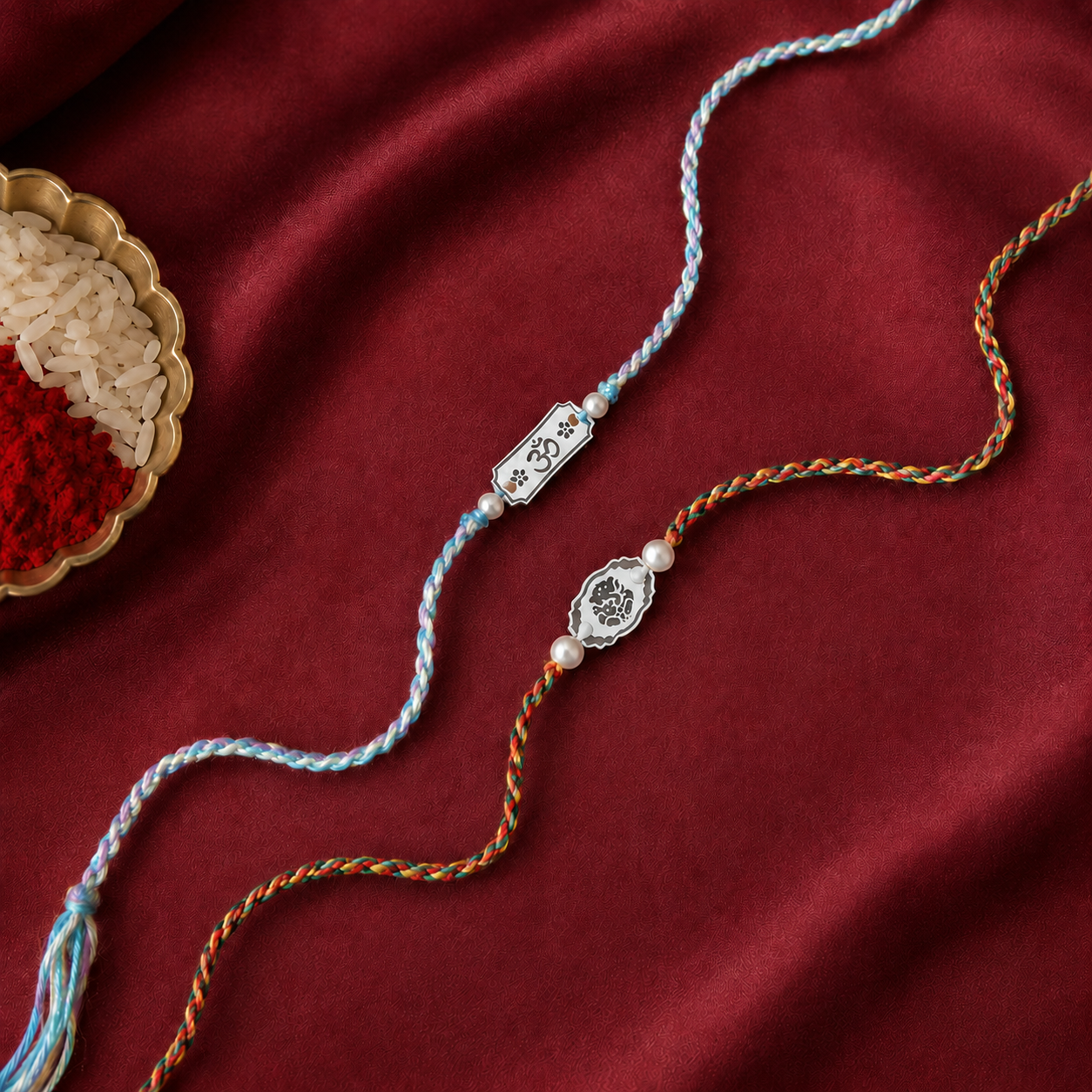 Silver Rakhi pair for brother with pearl beads and pastel blue red braided threads display
