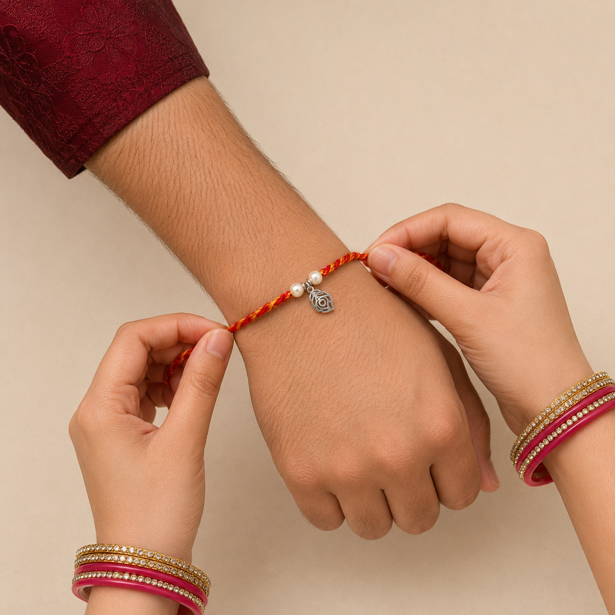 Sister tying sacred silver Morpankh peacock feather Rakhi on brother wrist during Raksha Bandhan