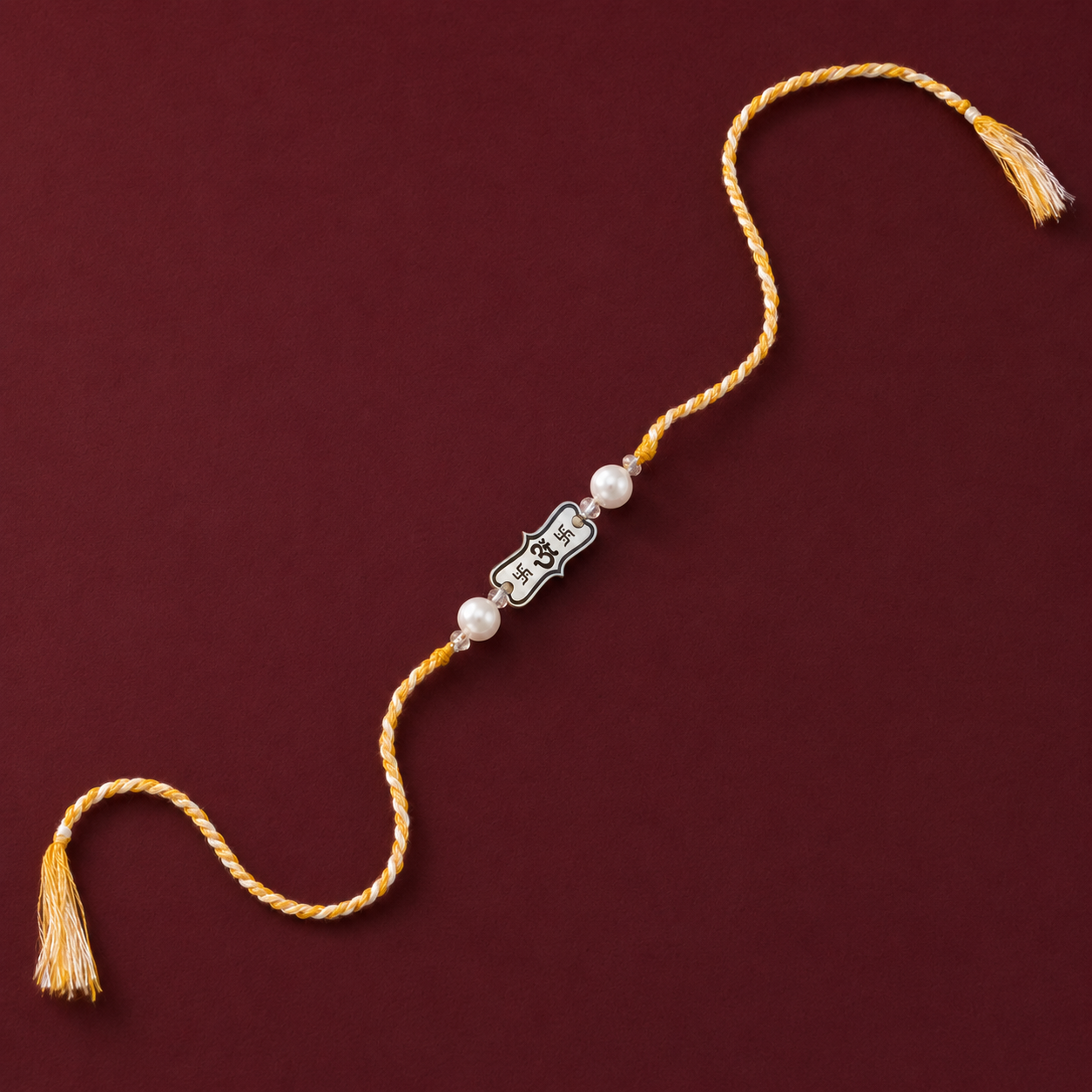 Silver Rakhi for brother with pearl beads Om Swastik center and yellow white braided thread