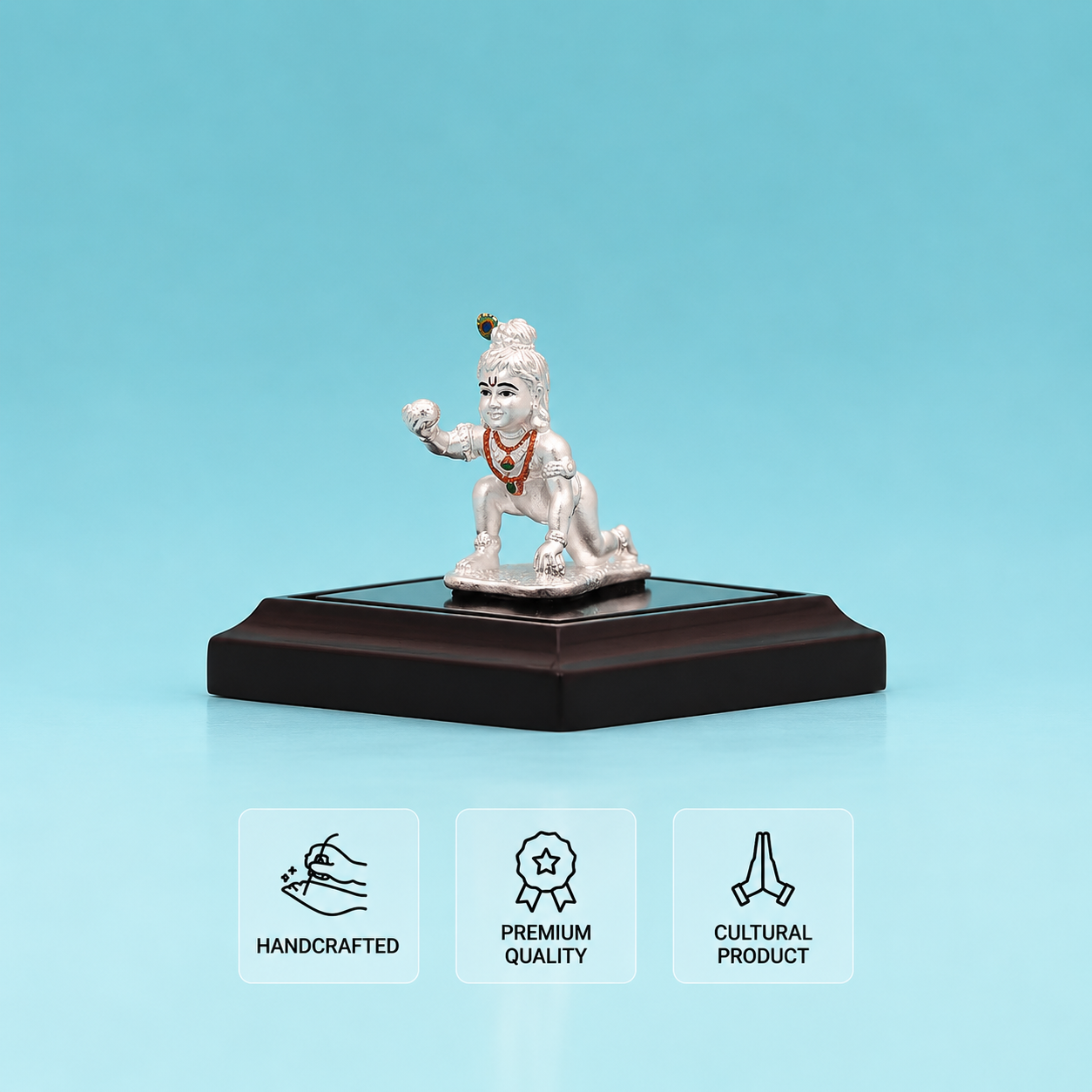 Silver Baby Krishna idol in a kneeling pose with traditional ornaments