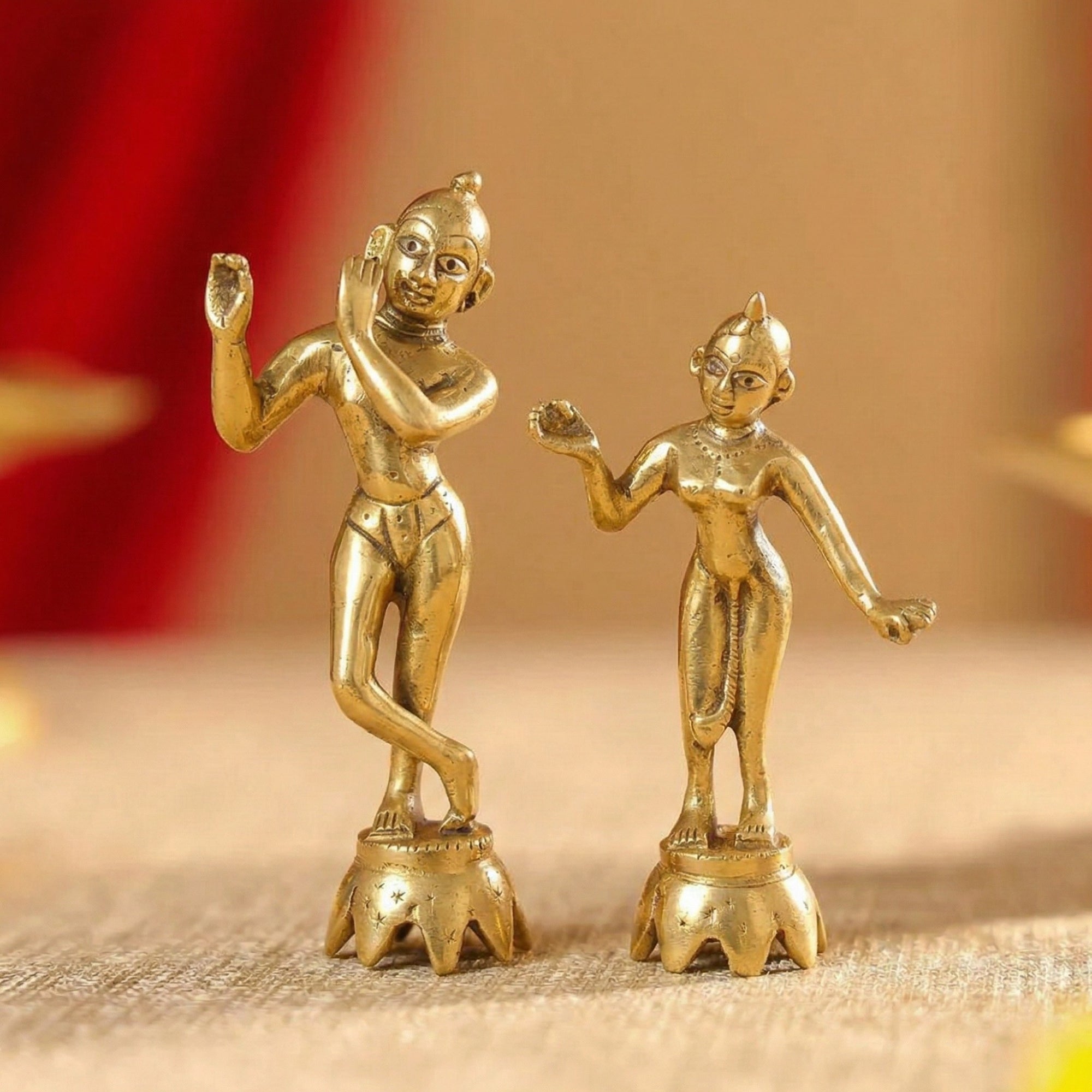 Golden finish plain Radha Krishna Ashtadhatu Yugal Jodi idols displayed on a wooden temple altar