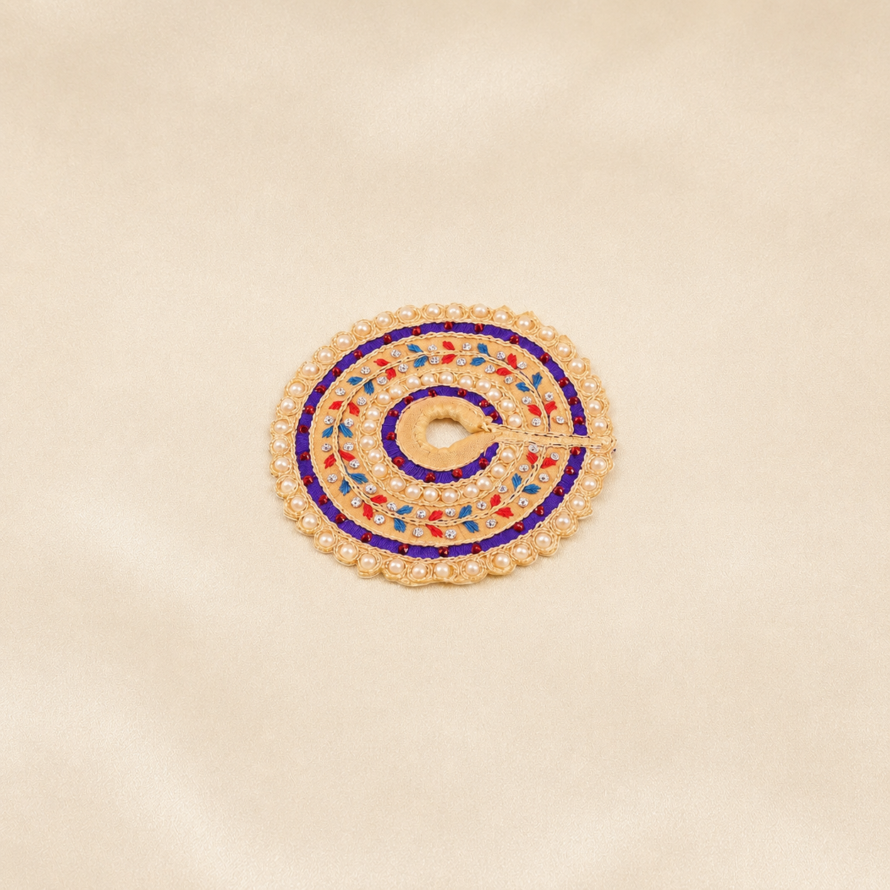 Small beige Laddu Gopal dress with purple bands, pearl border and colourful leaf embroidery