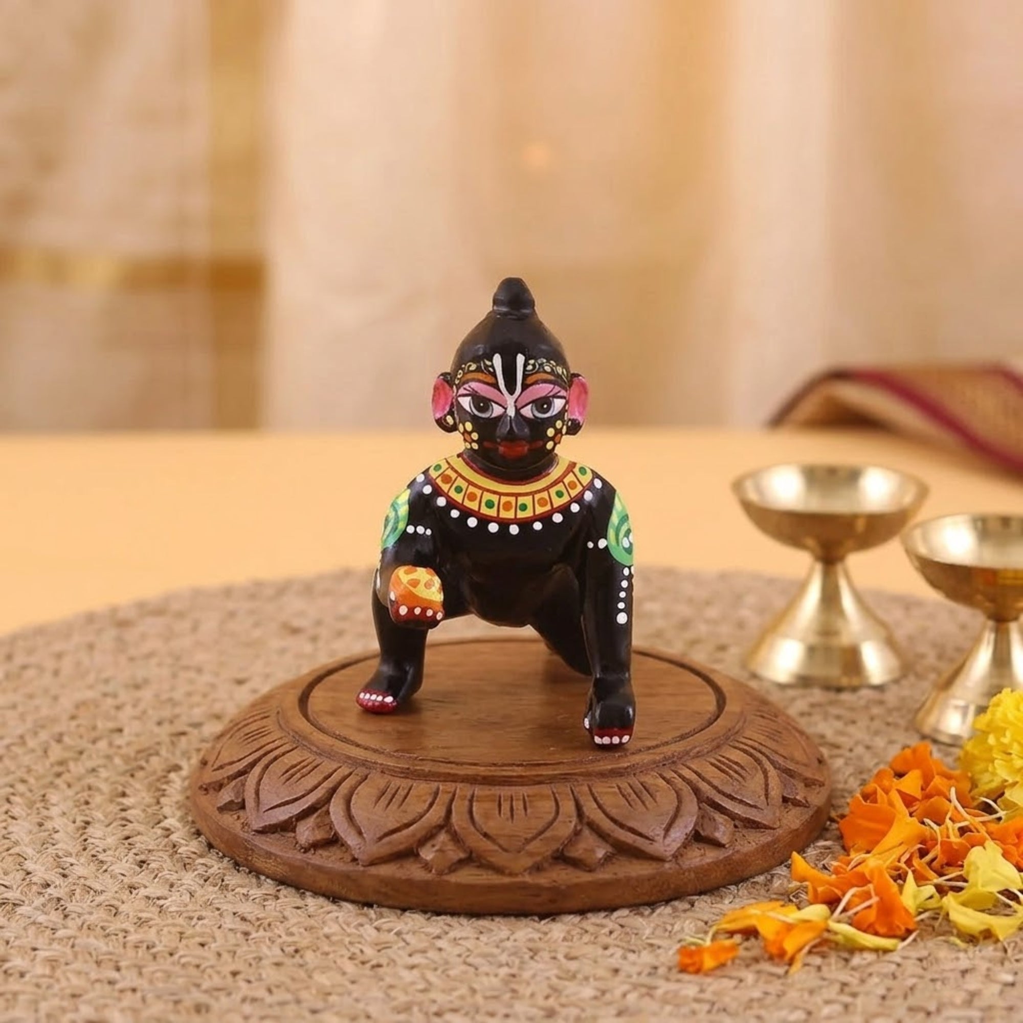 Hand-painted black Laddu Gopal Ashtadhatu idol sitting on a wooden stand