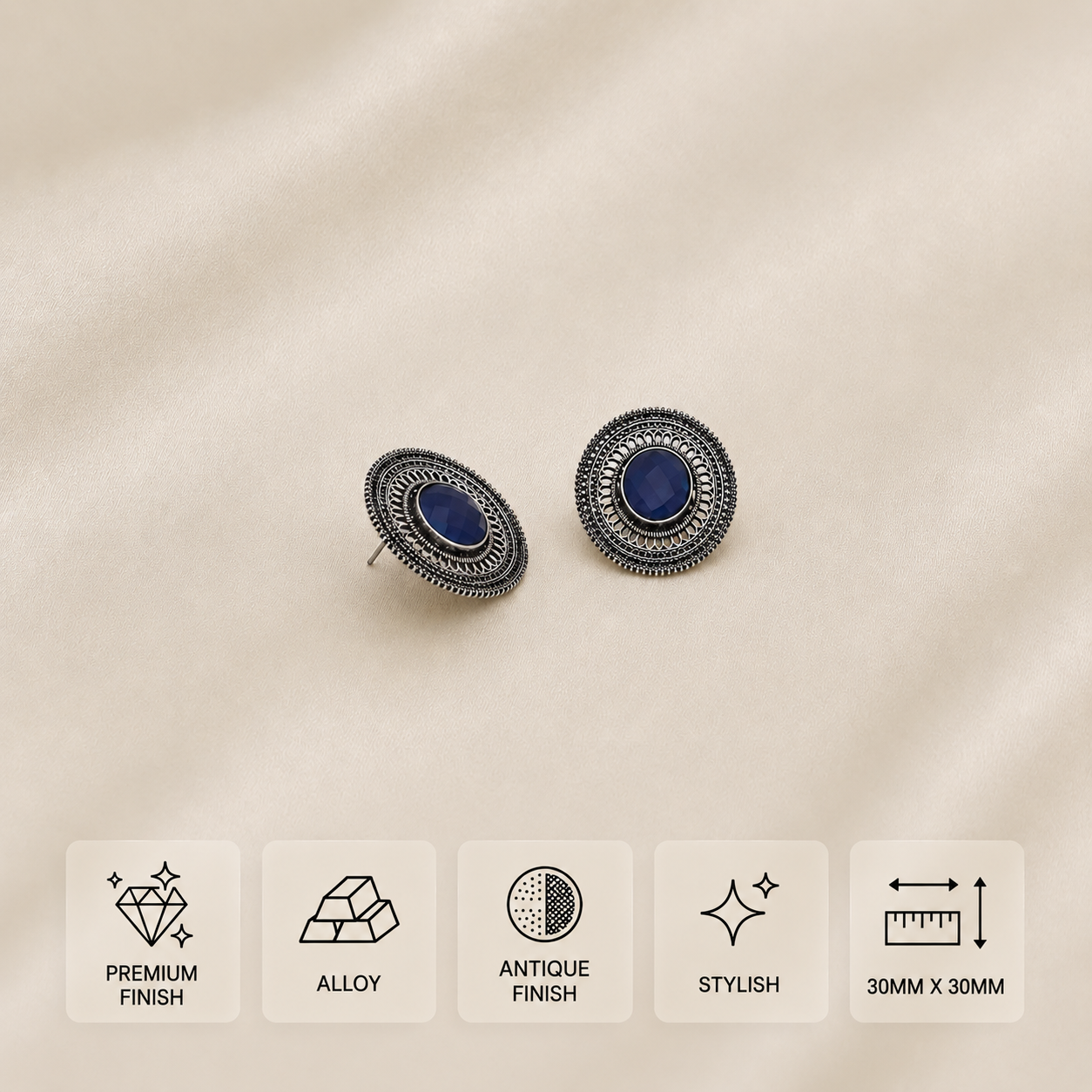 Silver-toned stud earrings with blue stones and intricate borders, measuring 30 × 30 mm.