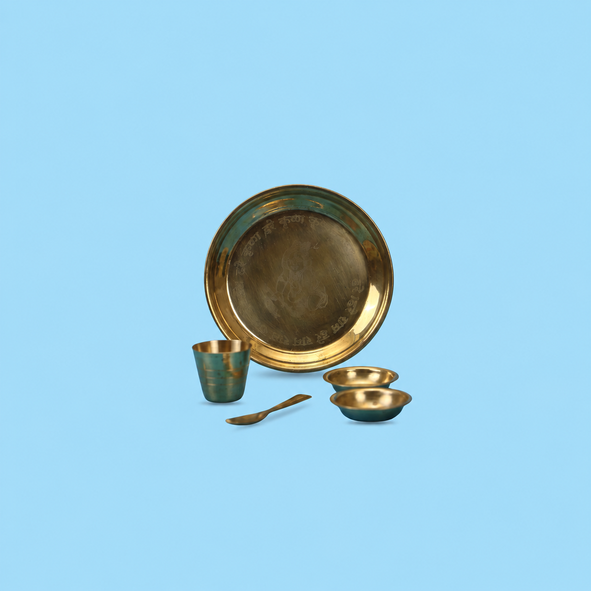 Brass puja utensil set with engraved thali, glass, spoon and two bowls