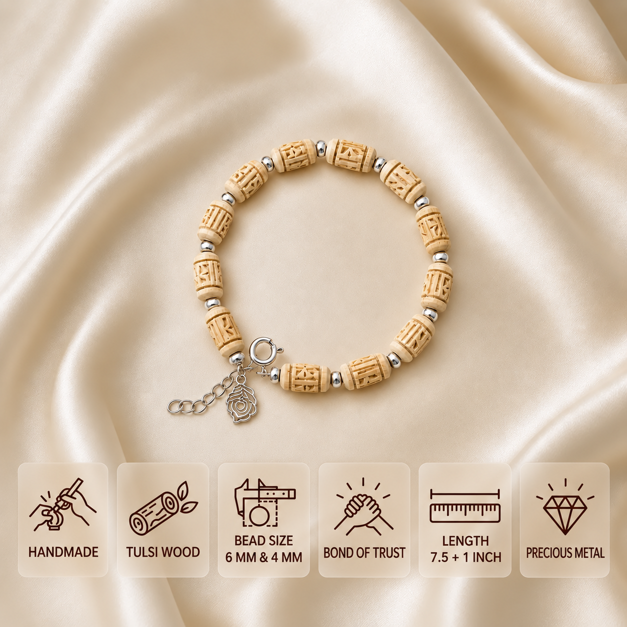 Carved Tulsi bead bracelet with silver-toned spacers and a charm, showing 6 mm and 4 mm beads and a 7.5 + 1 inch length.