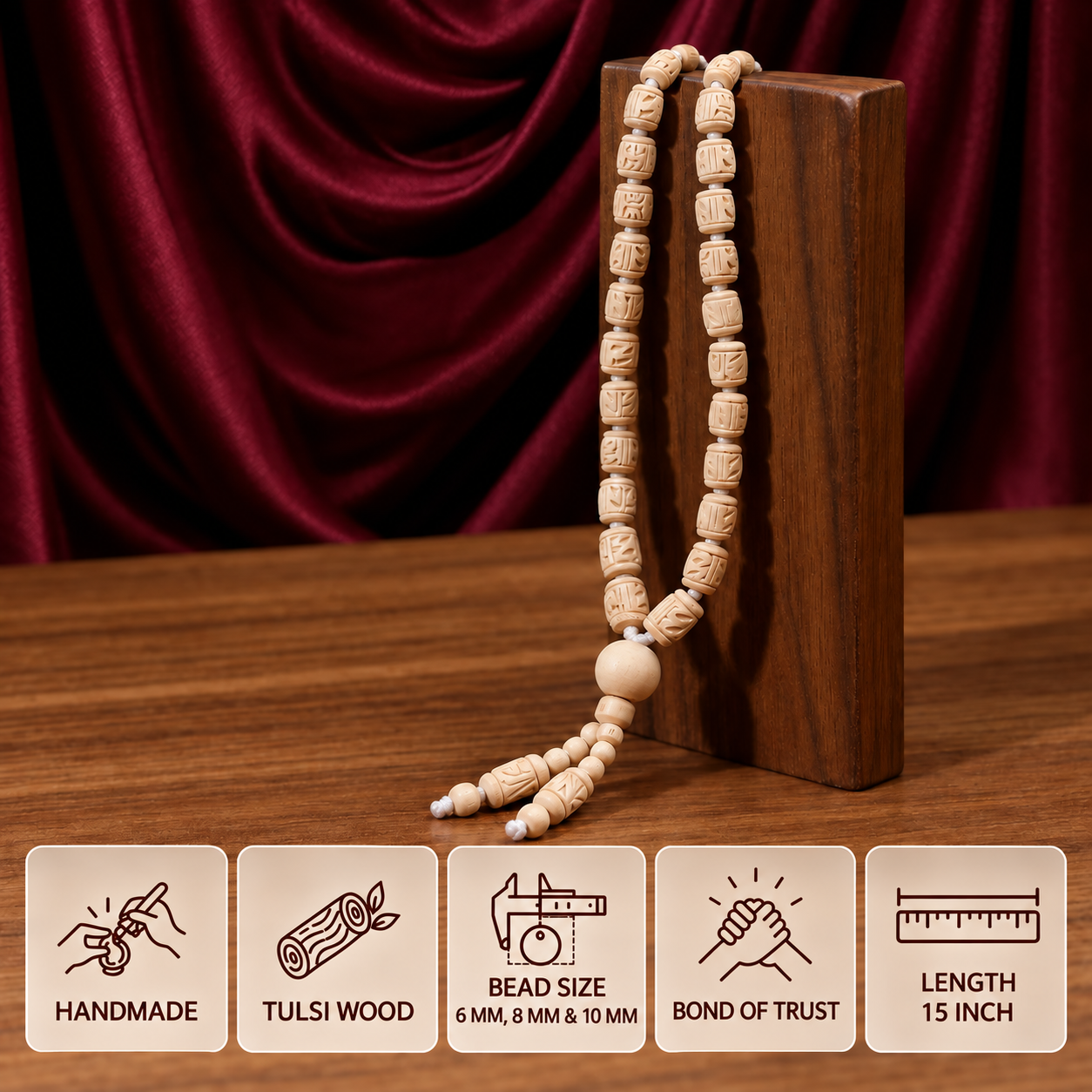 10-mm-15-inch.pngCarved Tulsi bead mala on a wooden stand with feature cards showing 6, 8 and 10 mm bead sizes and 15 inch length.