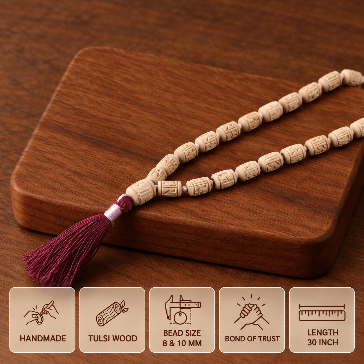 Carved Tulsi bead mala with burgundy tassel on a wooden board, showing 8 and 10 mm bead sizes and 30 inch length.