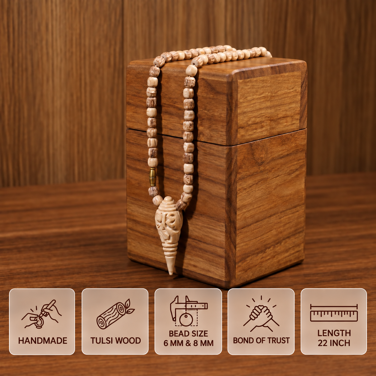 Tulsi bead mala with a carved pendant draped over a wooden box, with feature cards showing 6 and 8 mm bead sizes and 22 inch length.