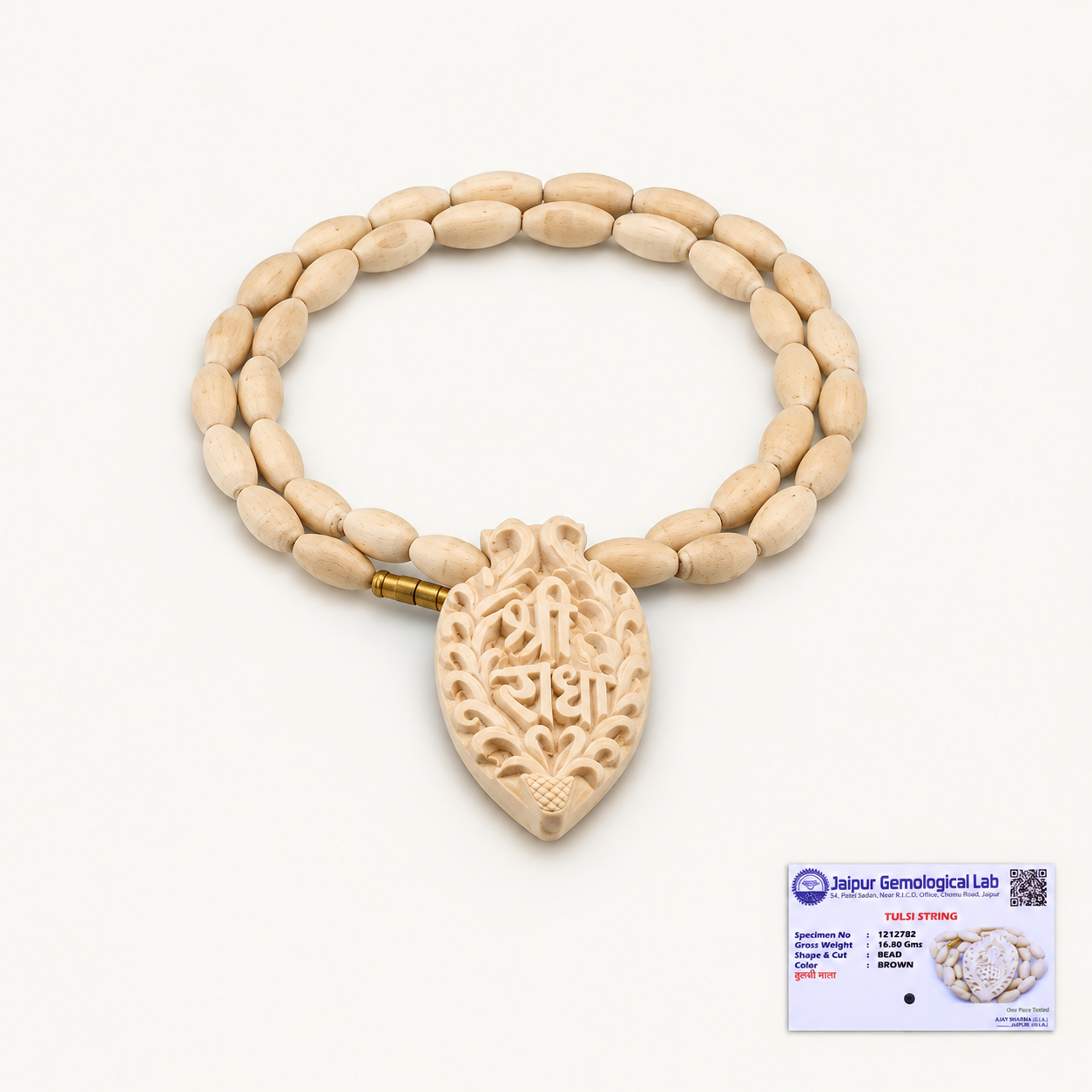 Carved Tulsi wood pendant mala with oval beads on an off-white background and a certificate at the bottom right.