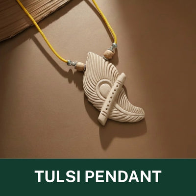 carved white tulsi wood pendant shaped like a feather, suspended on a bright yellow cord with small wooden beads