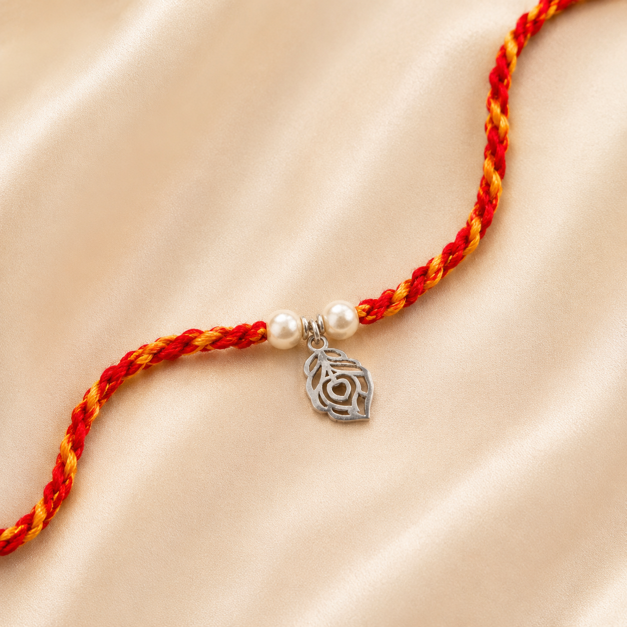 Close-up view of 925 sterling silver peacock feather charm with delicate white pearl detailing